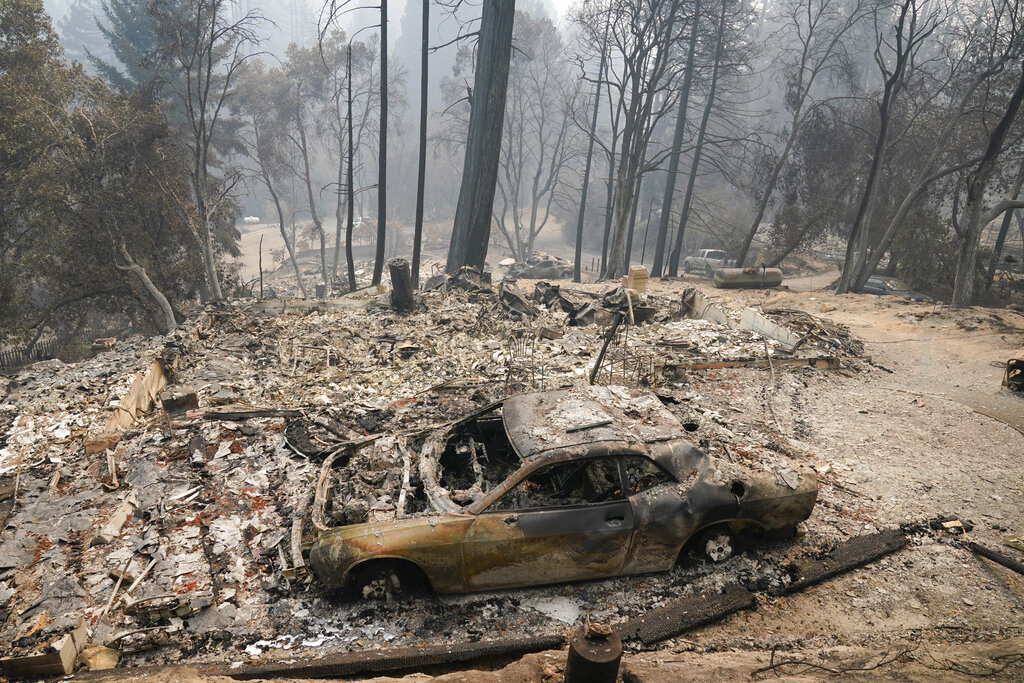 A fire-ravaged neighborhood is seen Tuesday, Aug. 25, 2020, in Boulder Creek, Calif., after the the CZU August Lightning Complex Fire passed by. (AP Photo/Marcio Jose Sanchez)