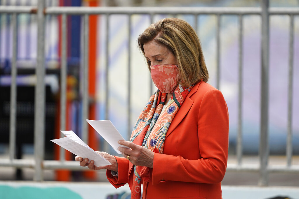 House Speaker Nancy Pelosi looks over her notes before speaking at a news conference at the Mission Education Center Elementary School, Wednesday, Sept. 2, 2020, in San Francisco. (AP Photo/Eric Risberg)