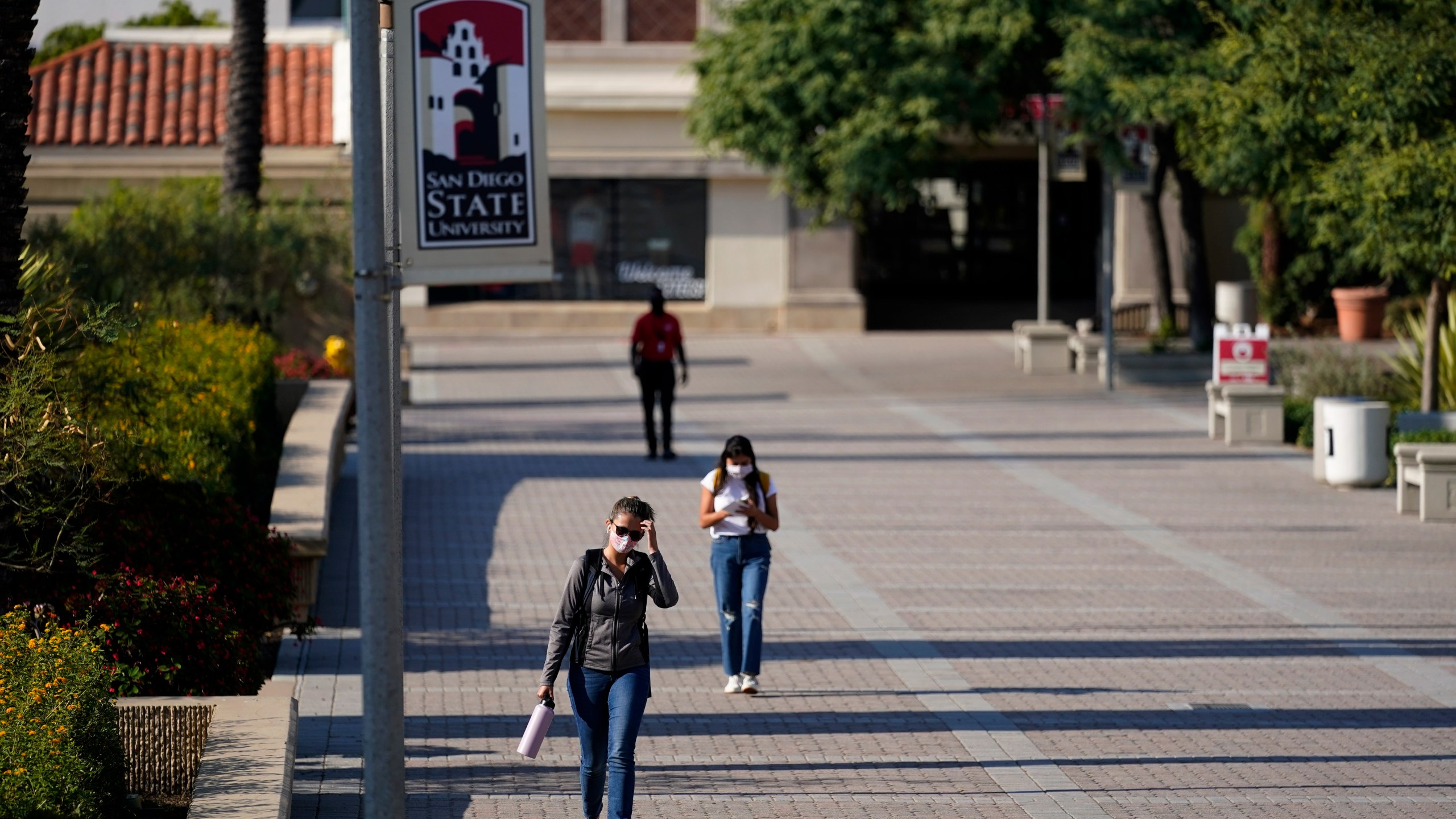 People walk on campus at San Diego State University on Sept. 2, 2020. (Gregory Bull/Associated Press)