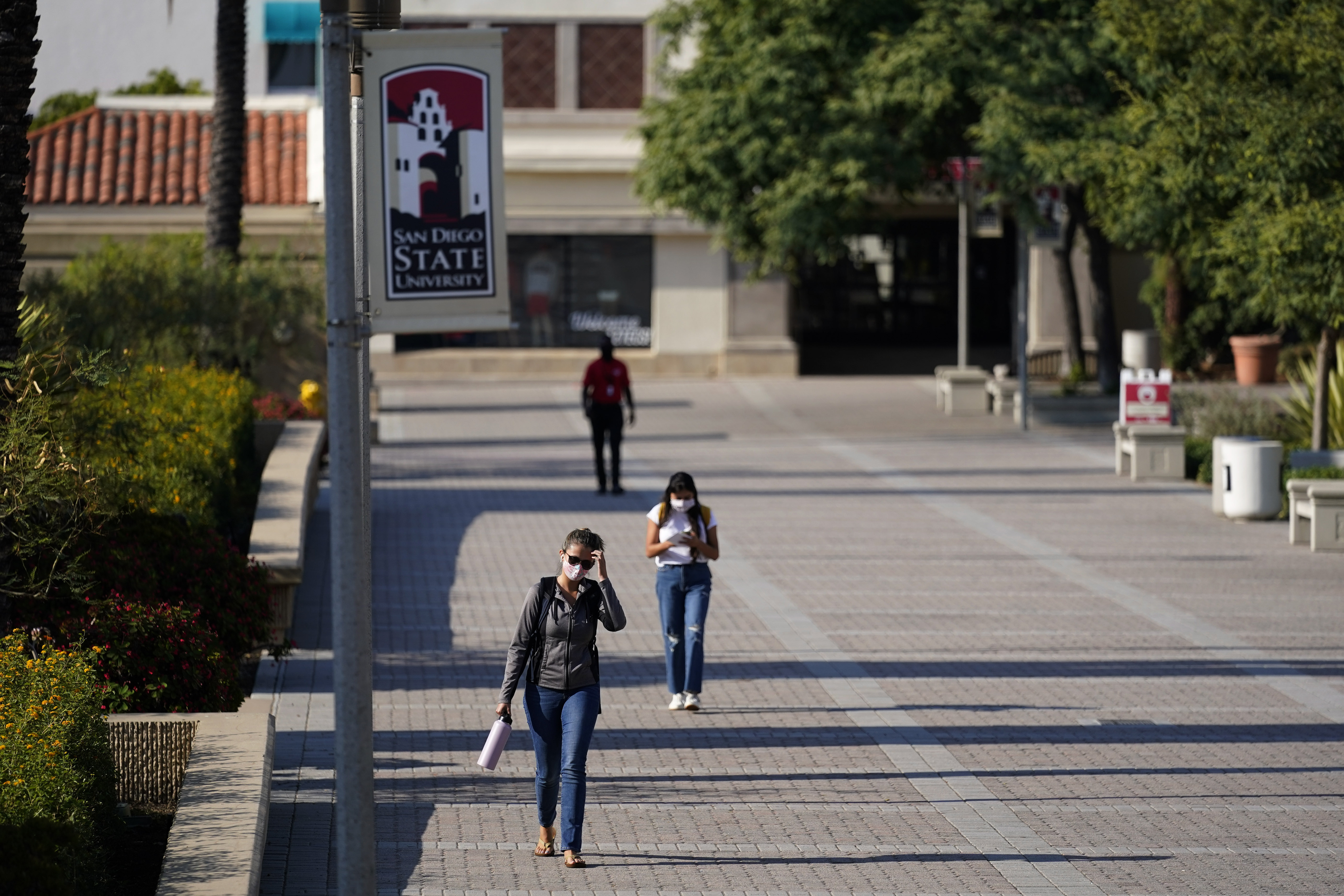 People walk on campus at San Diego State University on Sept. 2, 2020. (Gregory Bull/Associated Press)