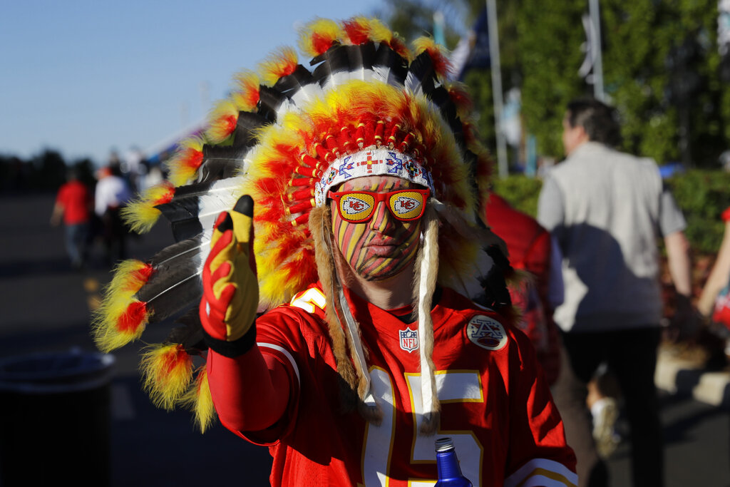 In this Feb. 2, 2020 file photo, a Kansas City Chiefs fan walks outside the stadium before the NFL Super Bowl 54 football game between the San Francisco 49ers and Kansas City Chiefs in Miami Gardens, Fla. (AP Photo/Seth Wenig) File)