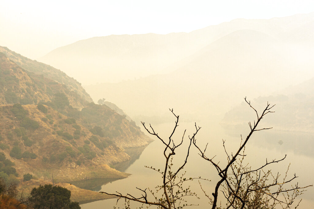 Smoke from the Bobcat Fire obscures the Morris Reservoir off Highway 39, Thursday, Sept. 10, 2020. (David Crane/The Orange County Register via AP)