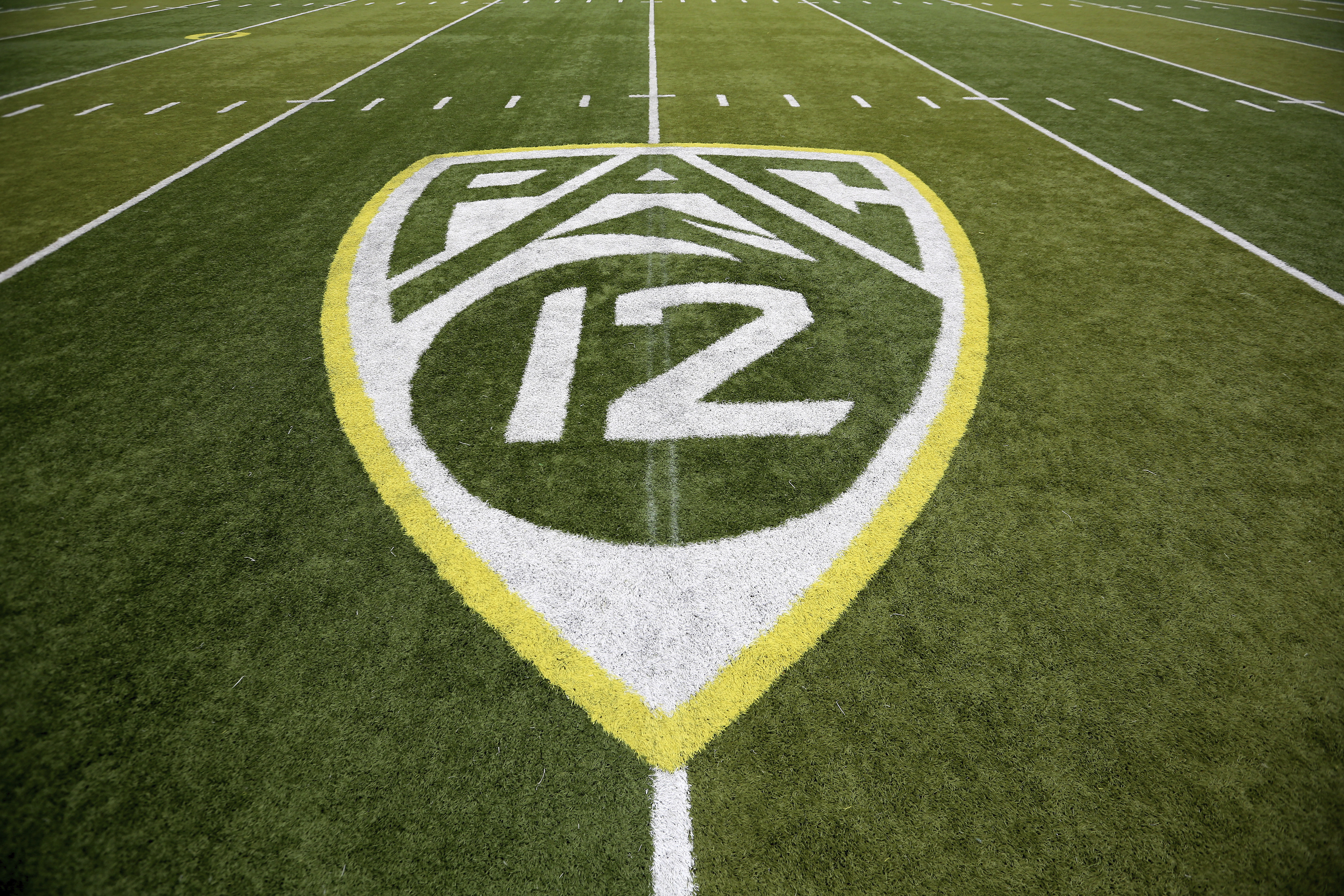 A Pac-12 logo is displayed on the field before an NCAA college football game between Washington State and Oregon in Eugene, Oregon, on Oct. 10, 2015. (Ryan Kang / Associated Press)