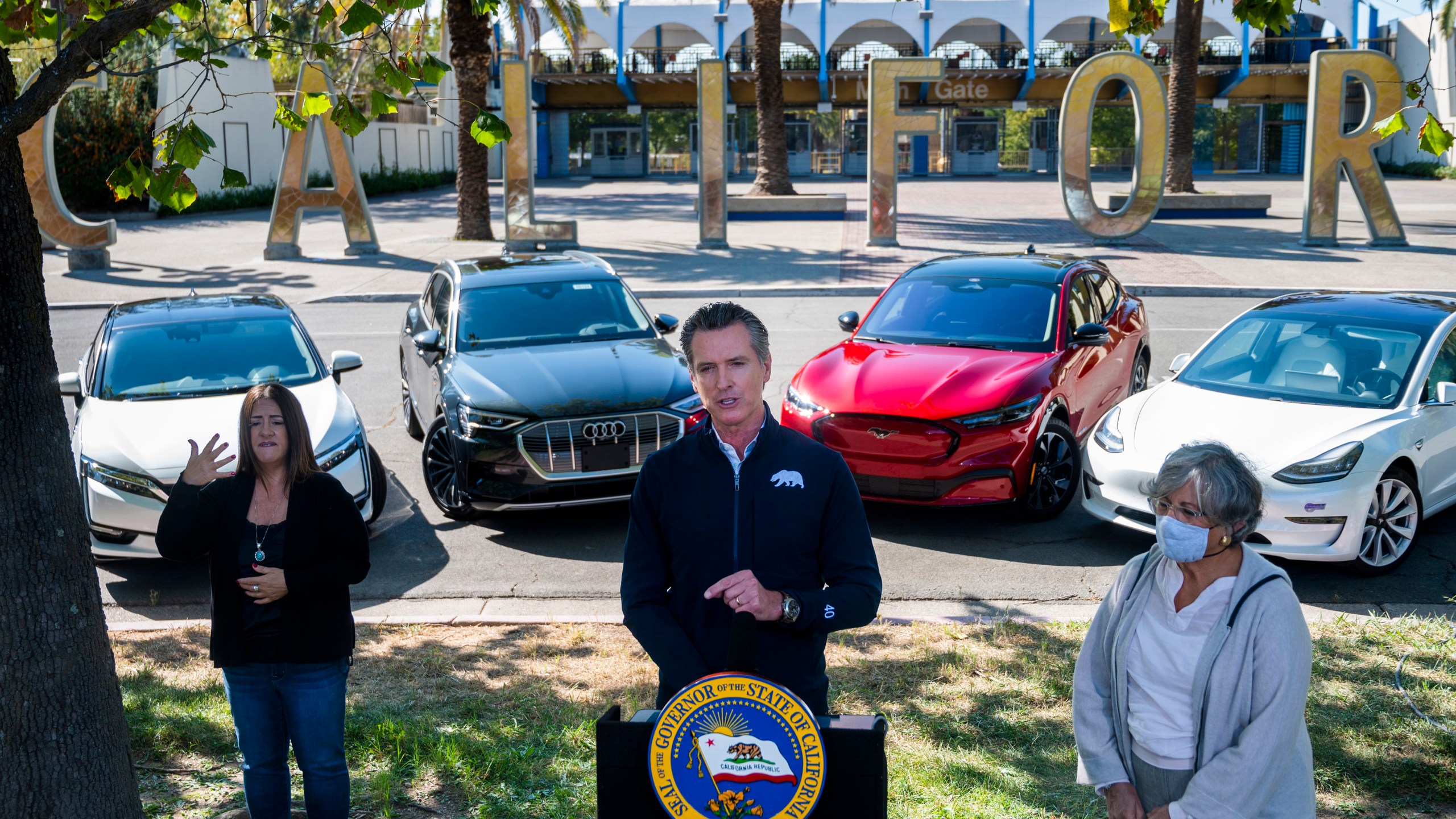 Gov. Gavin Newsom speaks at a press conference on Sept. 23, 2020, at Cal Expo in Sacramento where he announced an executive order requiring the sale of all new passenger vehicles to be zero-emission by 2035. (Daniel Kim/The Sacramento Bee via AP, Pool)