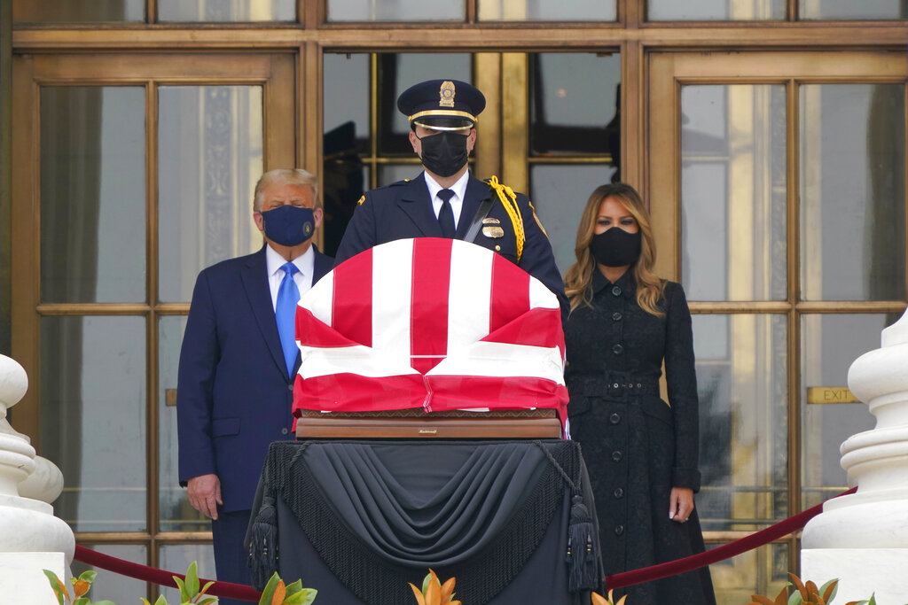 President Donald Trump and first lady Melania Trump pay respects as Justice Ruth Bader Ginsburg lies in repose at the Supreme Court building on Thursday, Sept. 24, 2020, in Washington. Ginsburg, 87, died of cancer on Sept. 18. (AP Photo/J. Scott Applewhite)