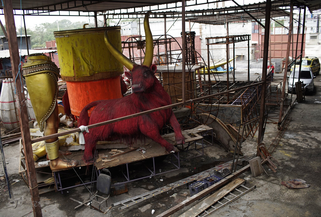 Carnival parade floats sit unfinished in the Unidos de Padre Miguel samba school workshop, in Rio de Janeiro, Brazil, Monday, Sept. 21, 2020. (AP Photo/Silvia Izquierdo)