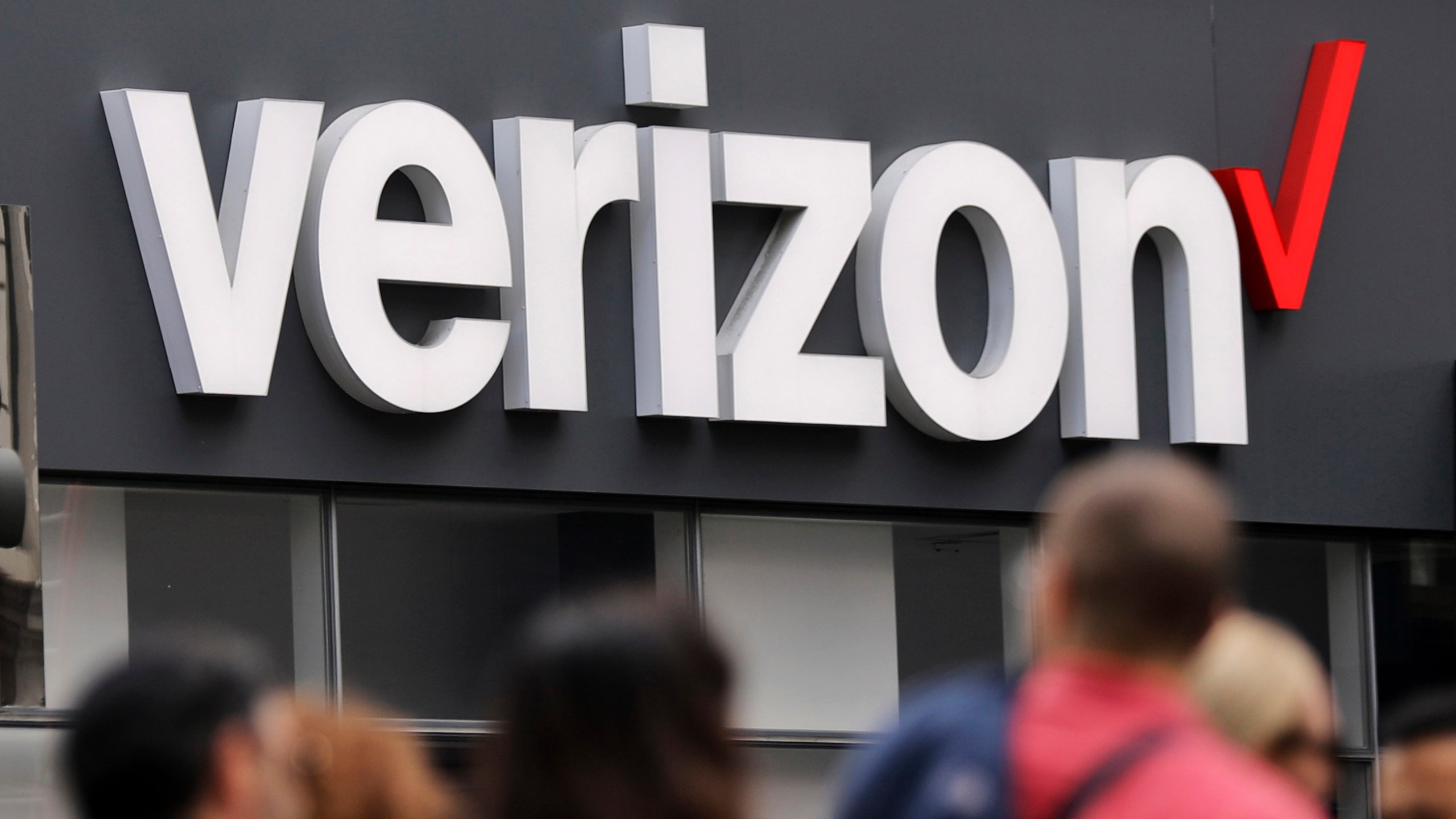 In this May 2, 2017, file photo, Verizon corporate signage is displayed on a store in Manhattan's Midtown area in New York.(AP Photo/Bebeto Matthews, File)