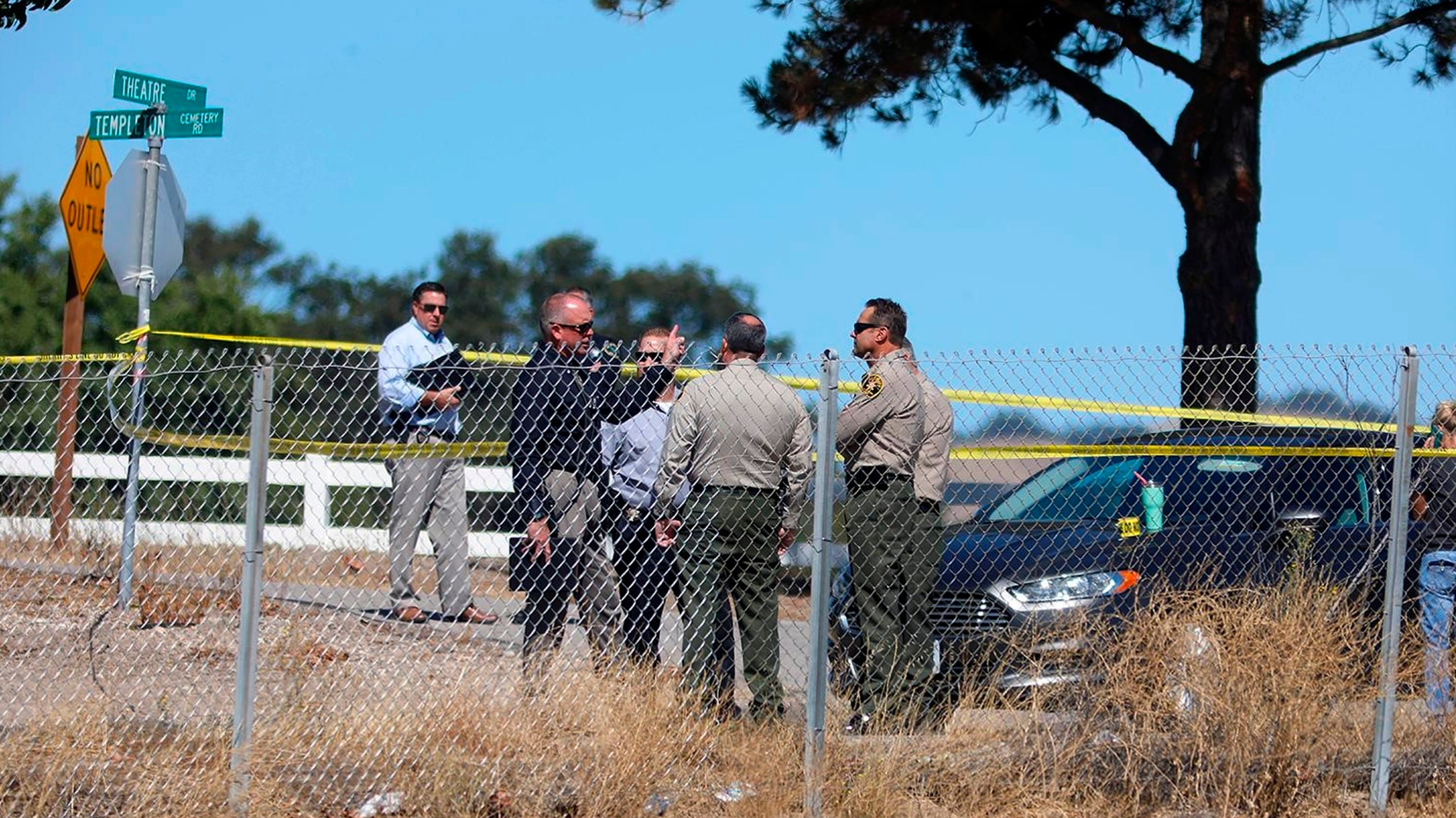 Investigators gather near the shooting scene in which a man was killed by sheriff's deputies after he shot and wounded a deputy in Templeton on Sept. 24, 2020. (Laura Dickinson / The Tribune via Associated Press)