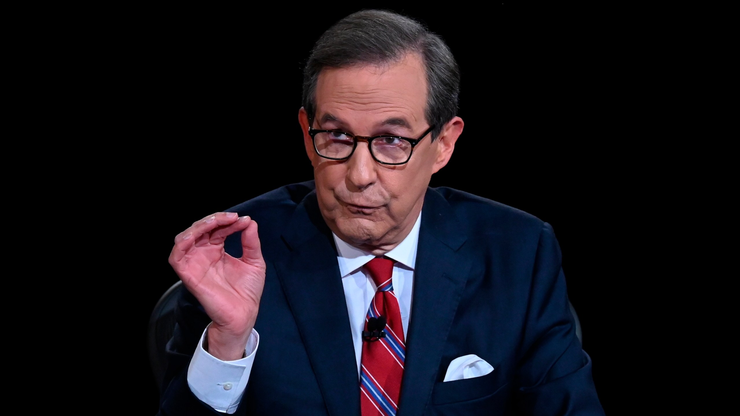 Moderator Chris Wallace of Fox News speaks as President Donald Trump and Democratic presidential candidate former Vice President Joe Biden participate in the first presidential debate on Sept. 29, 2020, in Cleveland. (Olivier Douliery/Pool via AP)