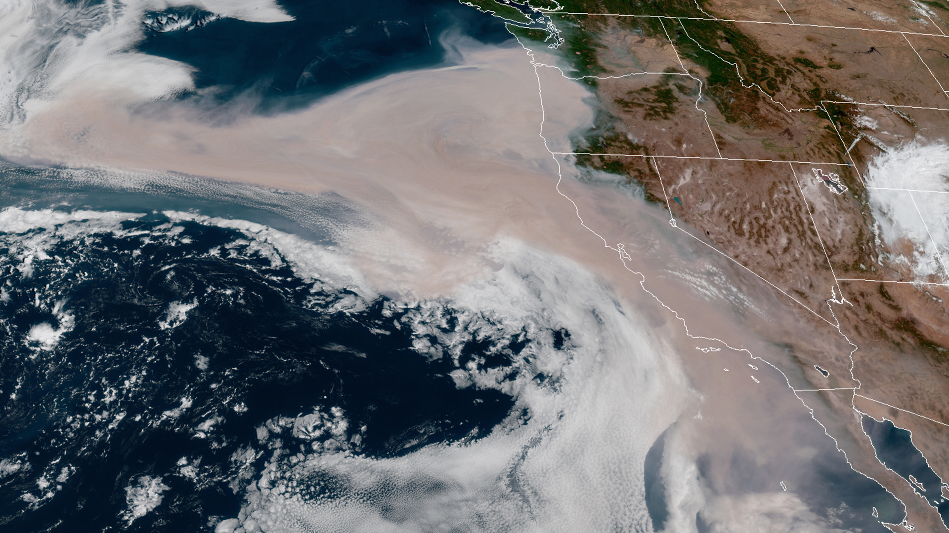 Satellite imagery shows smoke swirling over the Pacific Ocean from wildfires burning in California, Oregon and Washington on Sept. 10, 2020. (GOES-17/NOAA)