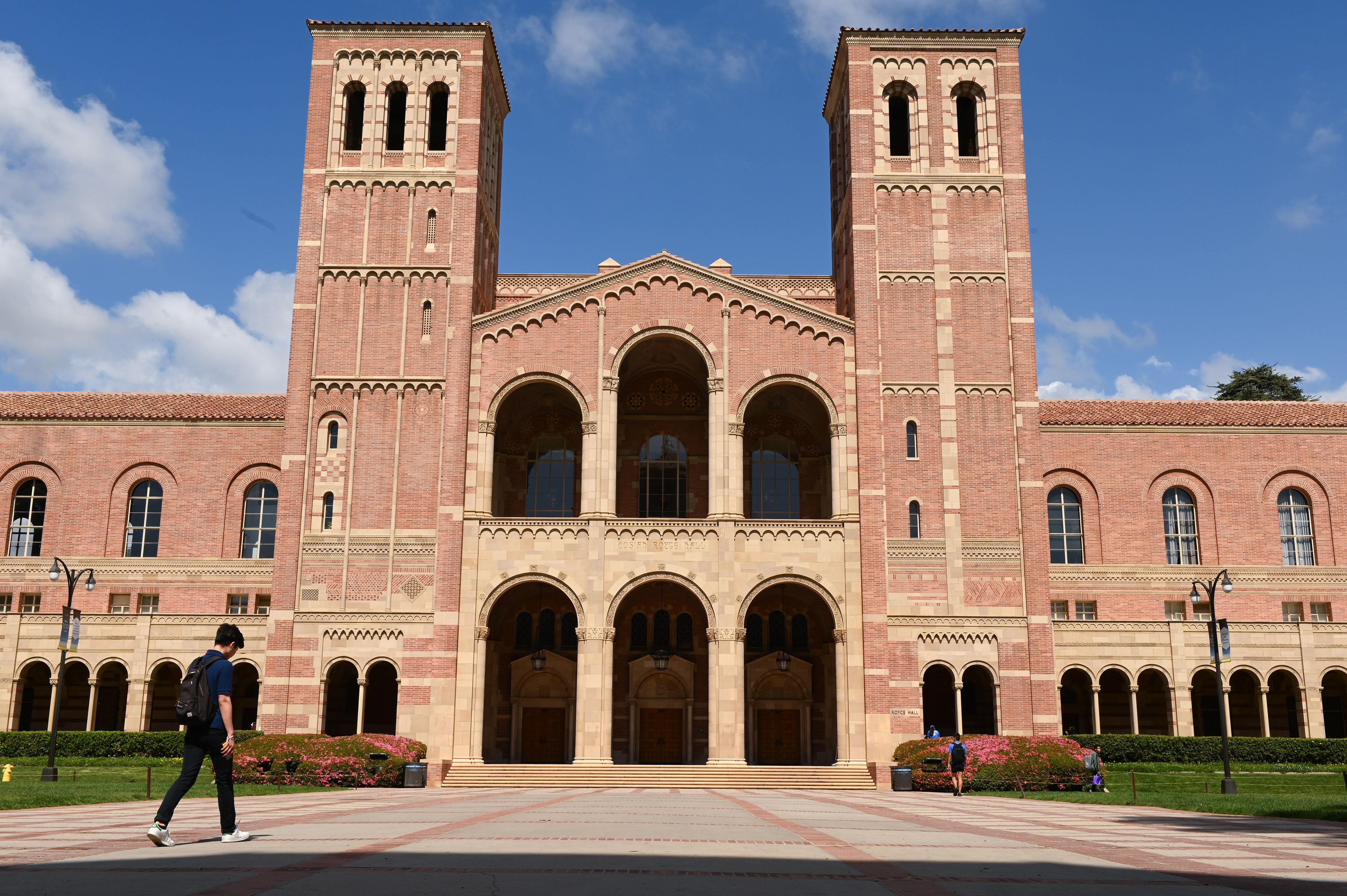 A student walks toward Royce Hall on the campus of UCLA on March 11, 2020. (ROBYN BECK/AFP via Getty Images)