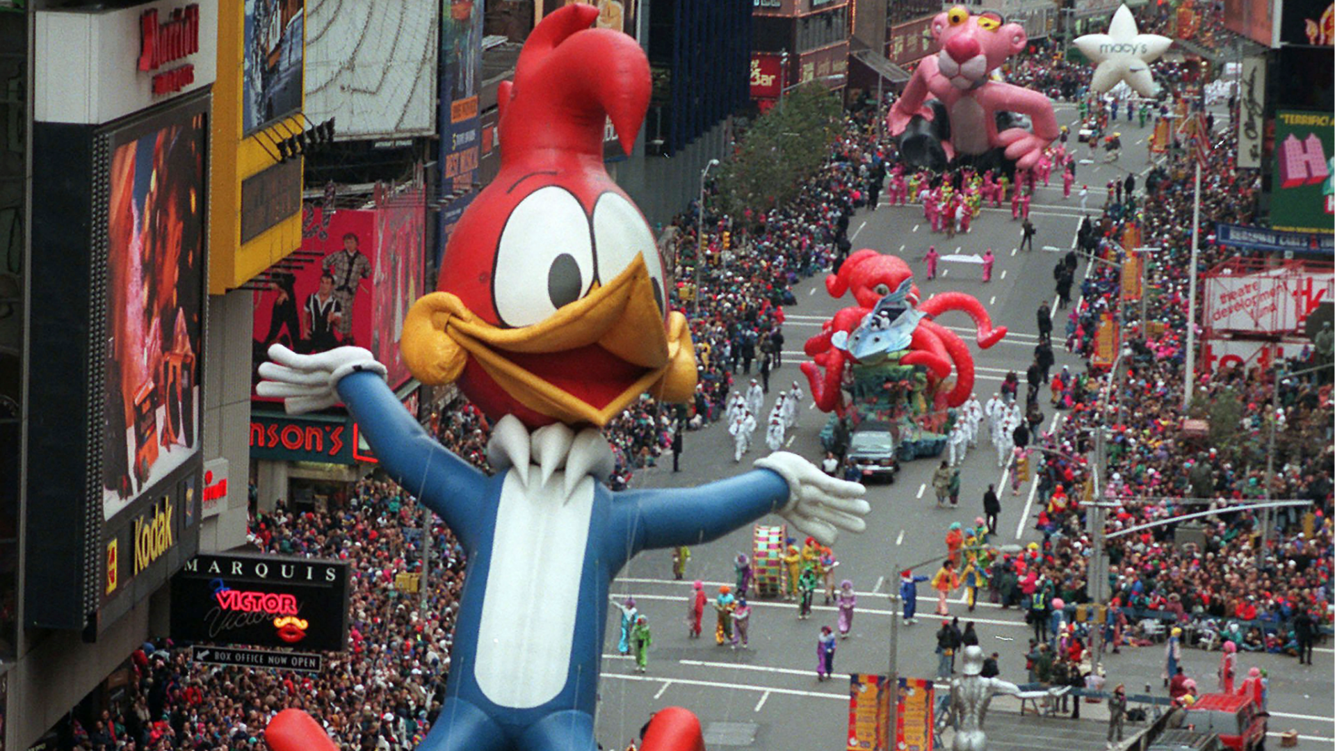 In this Nov. 23, 1995 file photo Woody Woodpecker leads a line of other balloons and floats into New York's Times Square during the 69th annual Macy's Thanksgiving Day parade. A Macy's Thanksgiving parade reimagined for the coronavirus pandemic will feature floats, performers and giant balloons parading along a one-block stretch of 34th Street in front of the retailer's flagship Manhattan store, Macy's officials announced Monday, Sept. 14, 2020. (AP Photo/Paul Hurschmann, File)