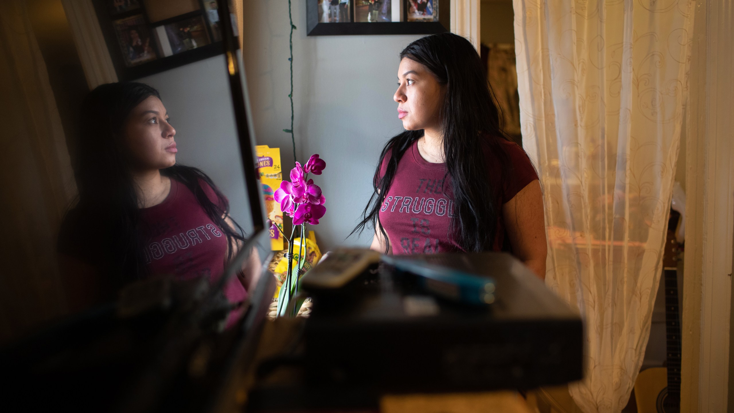 Juana, an undocumented immigrant, from El Salvador looks out from her apartment on March 25, 2020 in Norwalk, Connecticut. (John Moore/Getty Images)