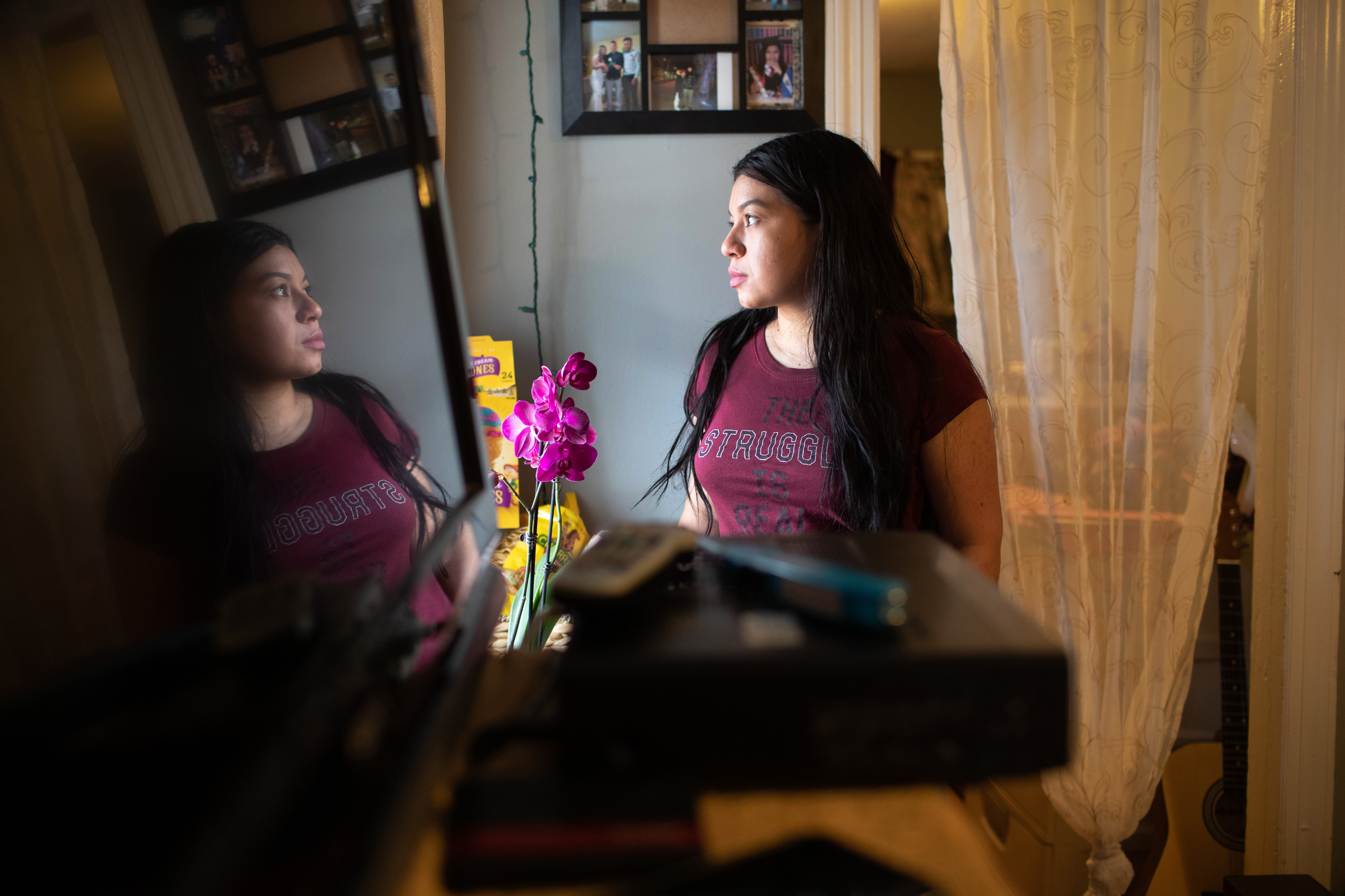 Juana, an undocumented immigrant, from El Salvador looks out from her apartment on March 25, 2020 in Norwalk, Connecticut. (John Moore/Getty Images)