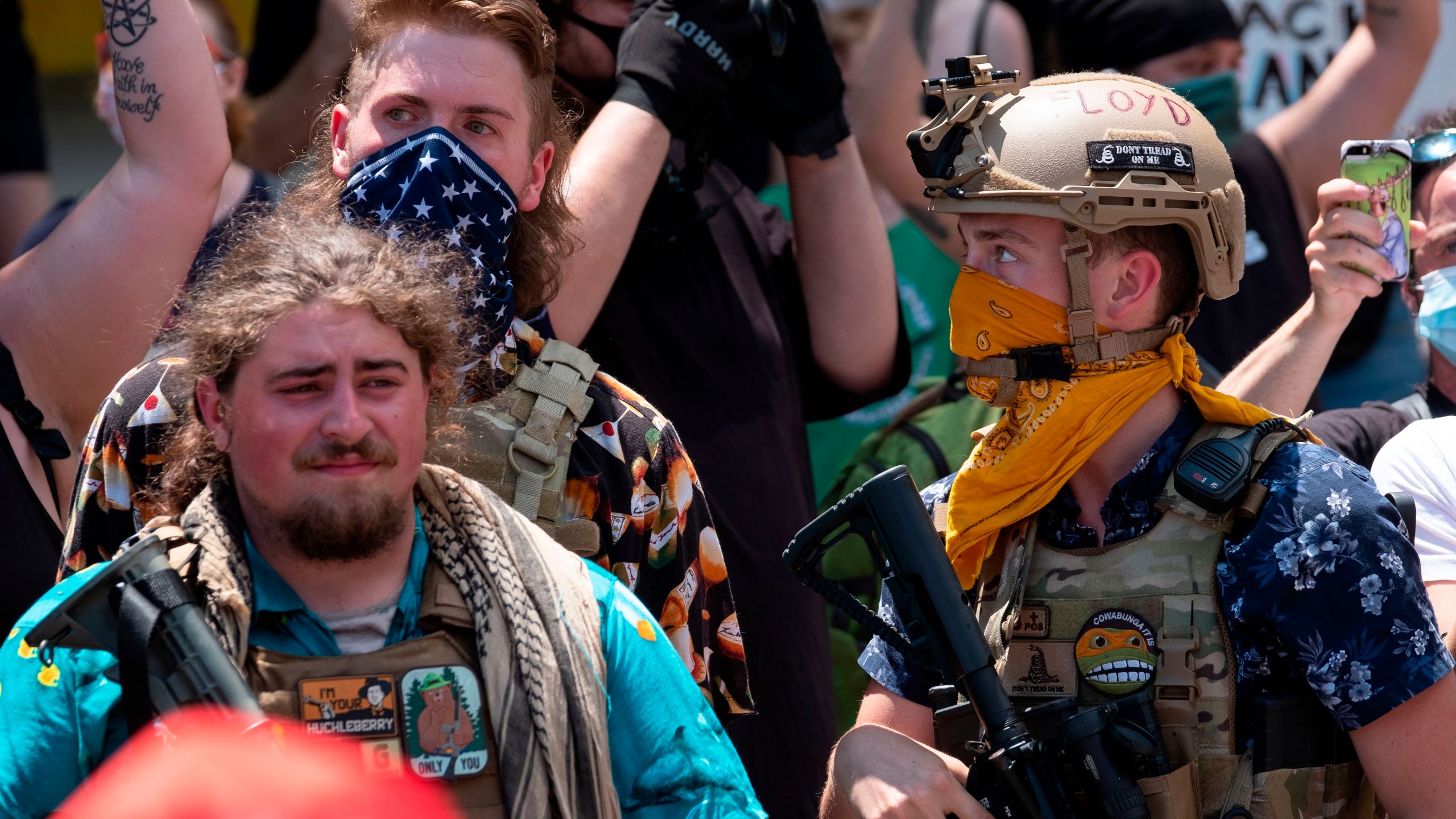 Members of the Boogaloo Movement stand in front of the Ohio Statehouse during a right-wing protest "Stand For America Against Terrorists and Tyrants" at State Capitol on July 18, 2020 in Columbus, Ohio. Protestors descended on Columbus, Ohio for a planned anti-mask rally in response to local laws requiring people to wear a mask in many Ohio cities. (Jeff Dean / AFP via Getty Images)