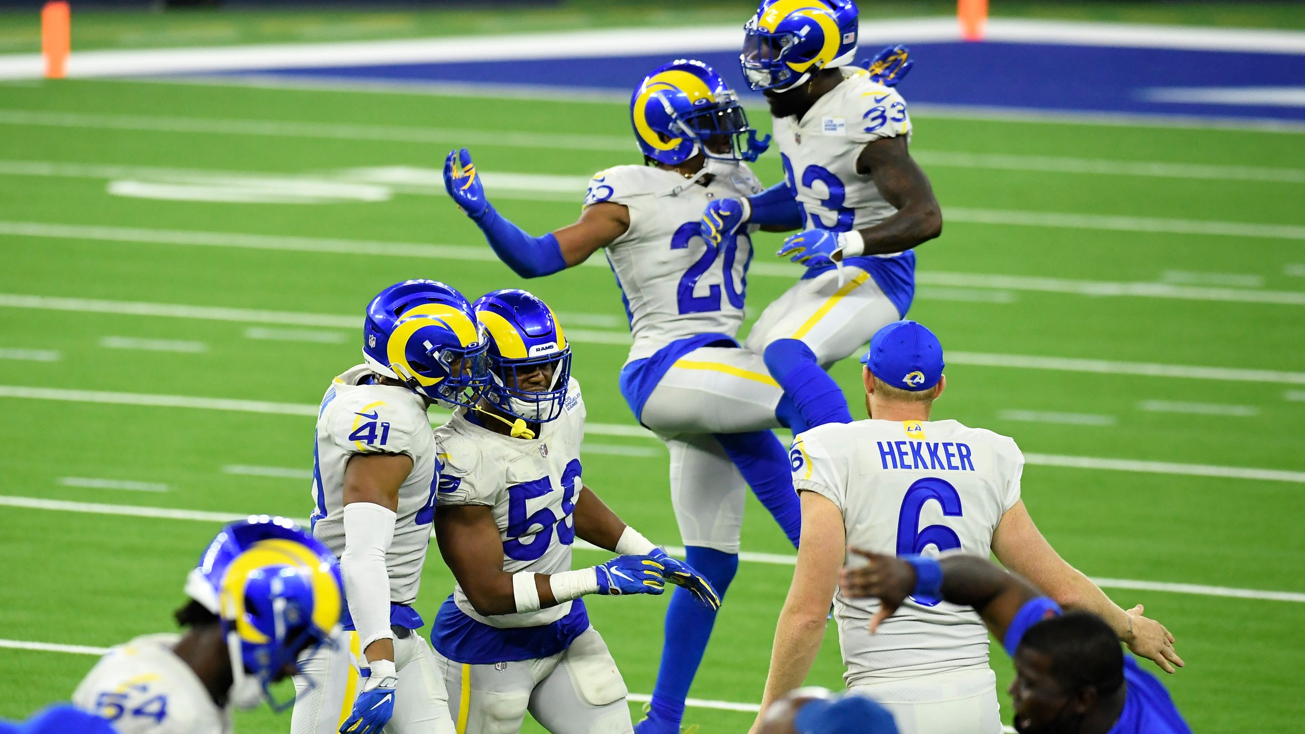 Justin Hollins #58 and Kenny Young #41 of the Los Angeles Rams celebrate after defeating the Dallas Cowboys 20-17 at SoFi Stadium on Sept. 13, 2020, in Inglewood, Calif. (Kevork Djansezian/Getty Images)