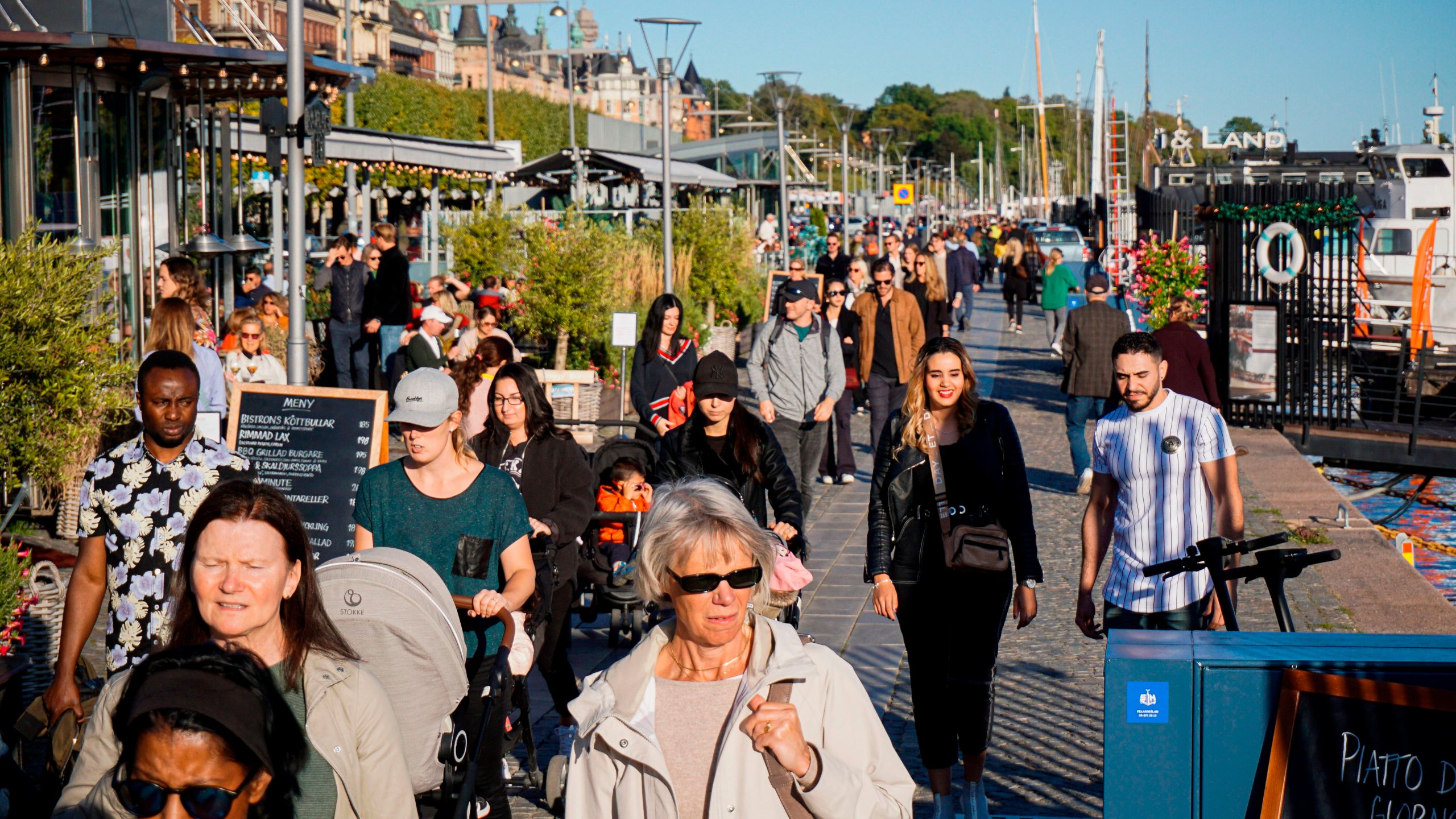 People walk on Stranvagen in Stockholm on Sept. 19, 2020, during the novel coronavirus COVID-19 pandemic. (Jonathan NACKSTRAND/AFP via Getty Images)