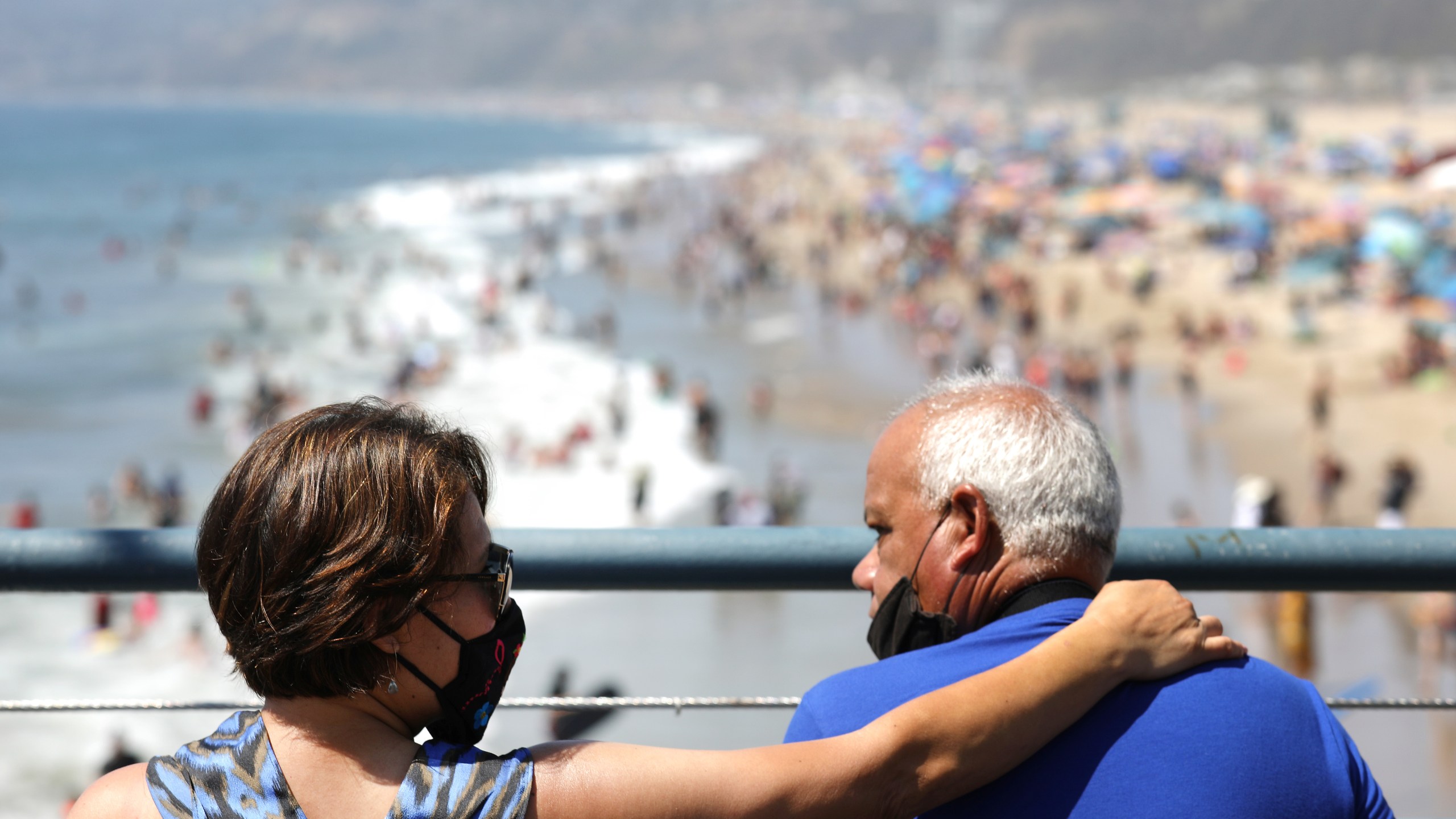 People sit on the Santa Monica pier as others gather on the beach on the first day of the Labor Day weekend on Sept. 5, 2020 in Santa Monica. (Mario Tama/Getty Images)