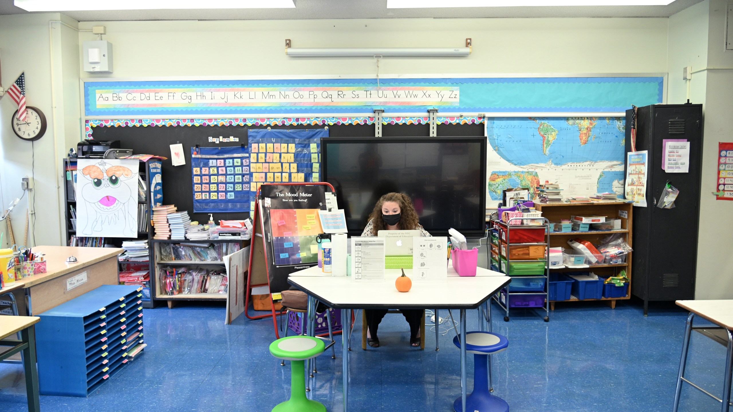 Emma Kash, a teacher at Yung Wing School P.S. 124 wears a mask and teaches remotely from her classroom on Sept. 24, 2020 in New York City. (Michael Loccisano/Getty Images)