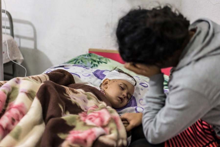 Anahit Gevorgyan sits with her son Artsvik, 2, after he was injured and her 8-year-old daughter was killed by fighting in their village of Martuni two days earlier, on Sept. 29, 2020 in Nagorno Karabakh after Azerbaijani forces attacked the region. (Photo by Brendan Hoffman/Getty Images)