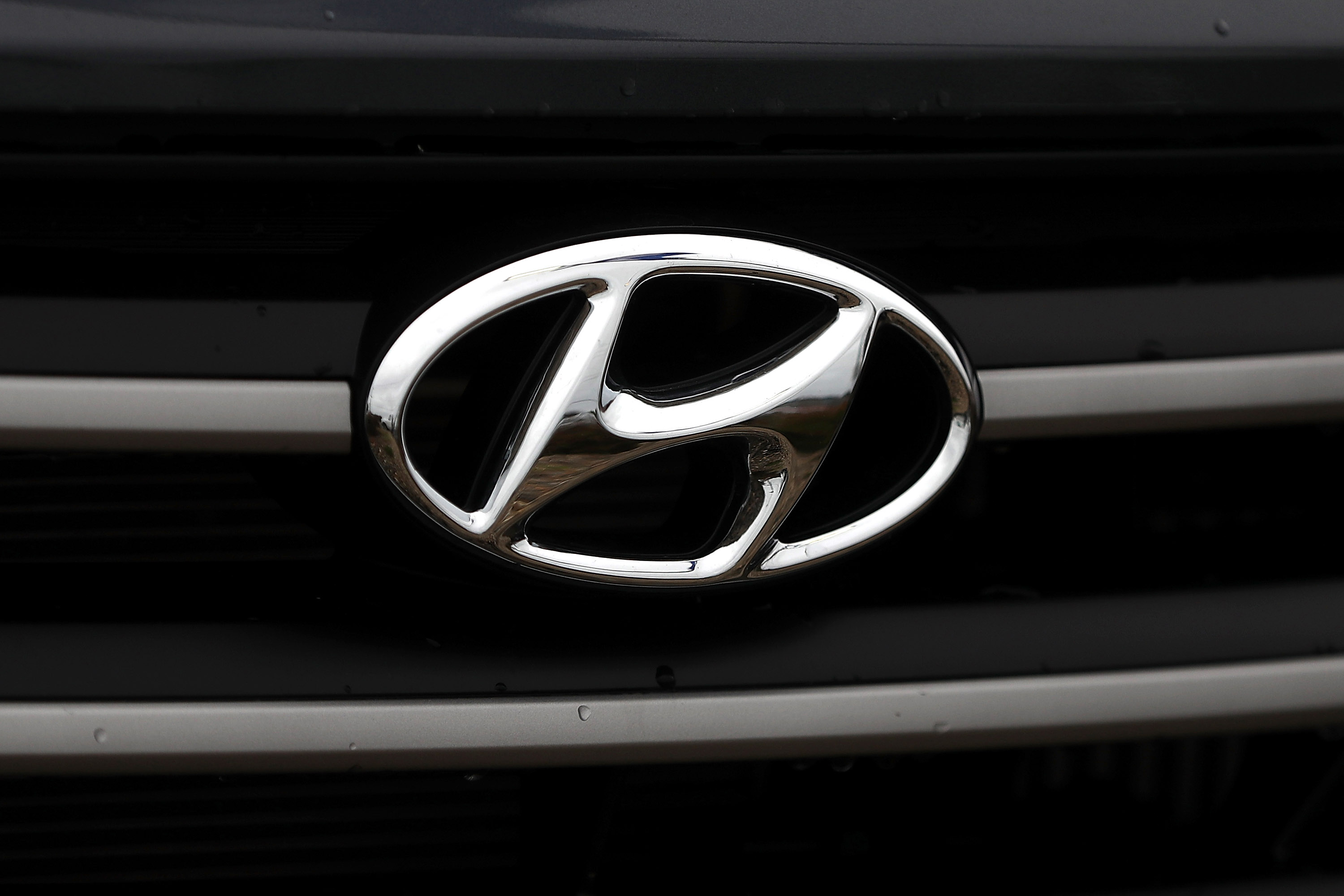 The Hyundai logo is displayed on a brand new Hyundai Santa Fe SUV at a Hyundai dealership on April 7, 2017 in Colma, California. (Justin Sullivan/Getty Images)