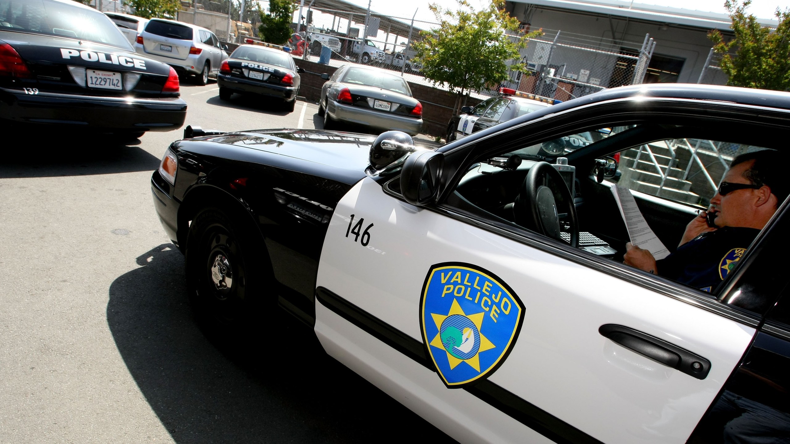 A Vallejo Police Department corporal goes over paperwork in his patrol car on May 7, 2008, in Vallejo. (Justin Sullivan / Getty Images)