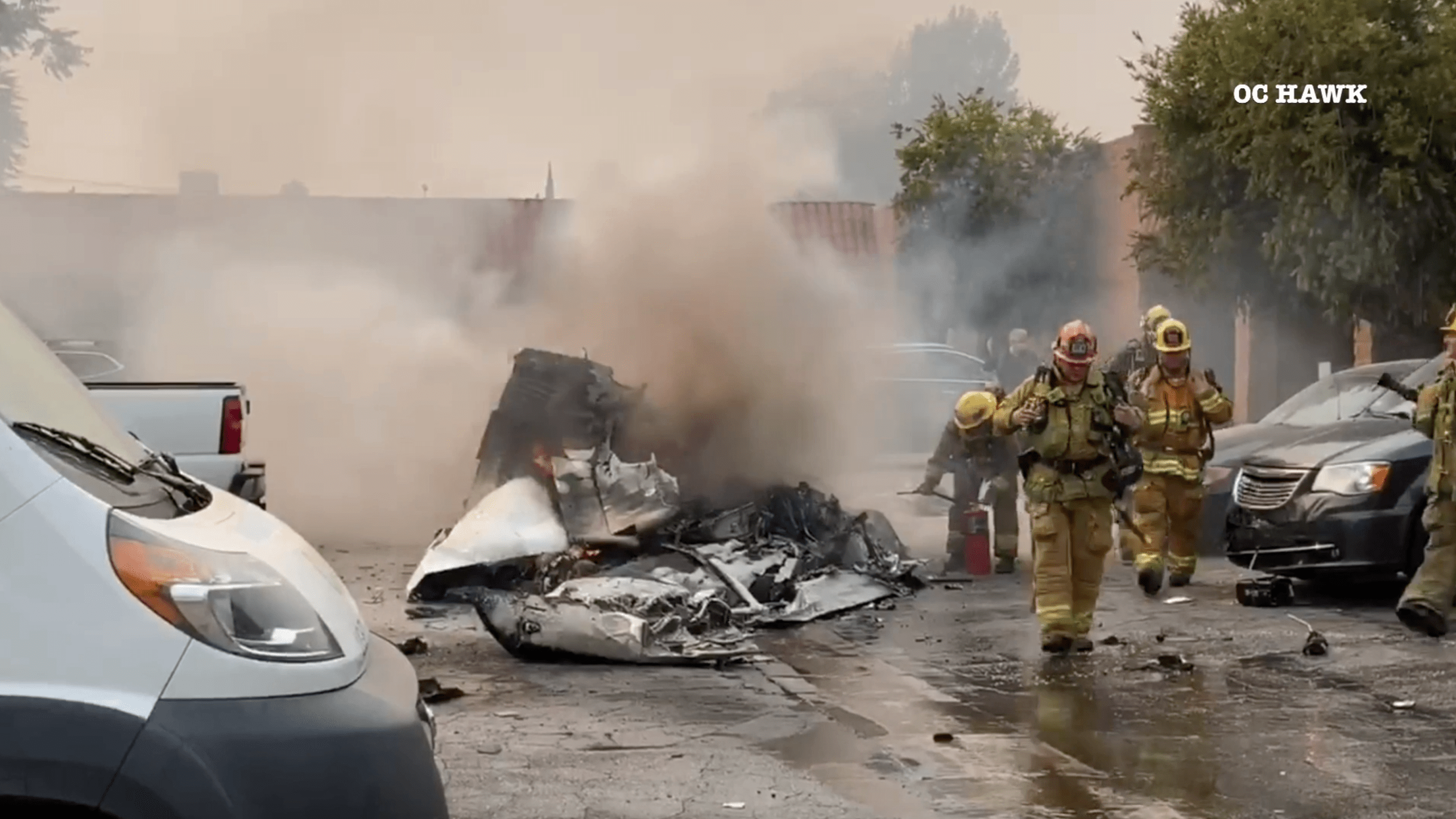 Firefighters respond to the scene of a deadly plane crash near Van Nuys Airport on Sept. 11, 2020. (OC Hawk)