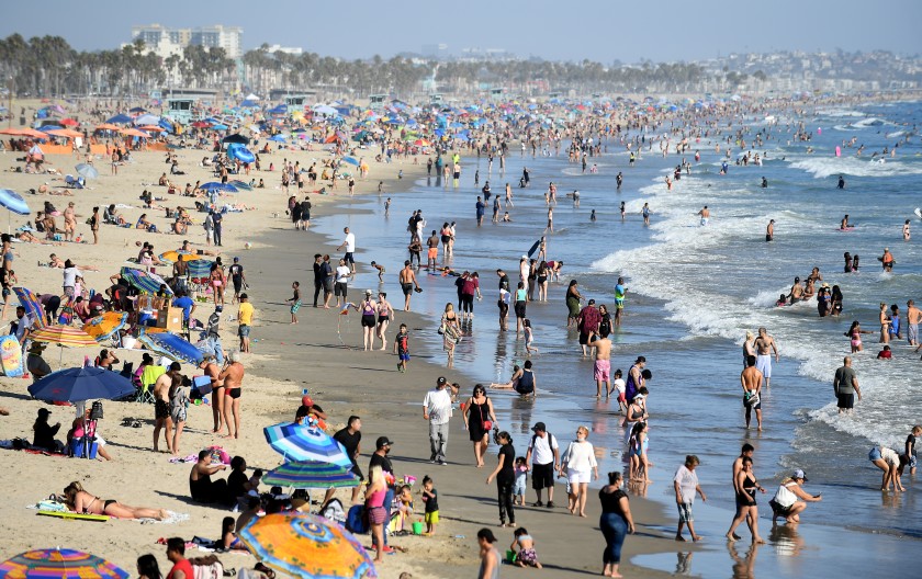 Beachgoers enjoy a sunny summer day in Santa Monica in August.(Wally Skalij / Los Angeles Times)