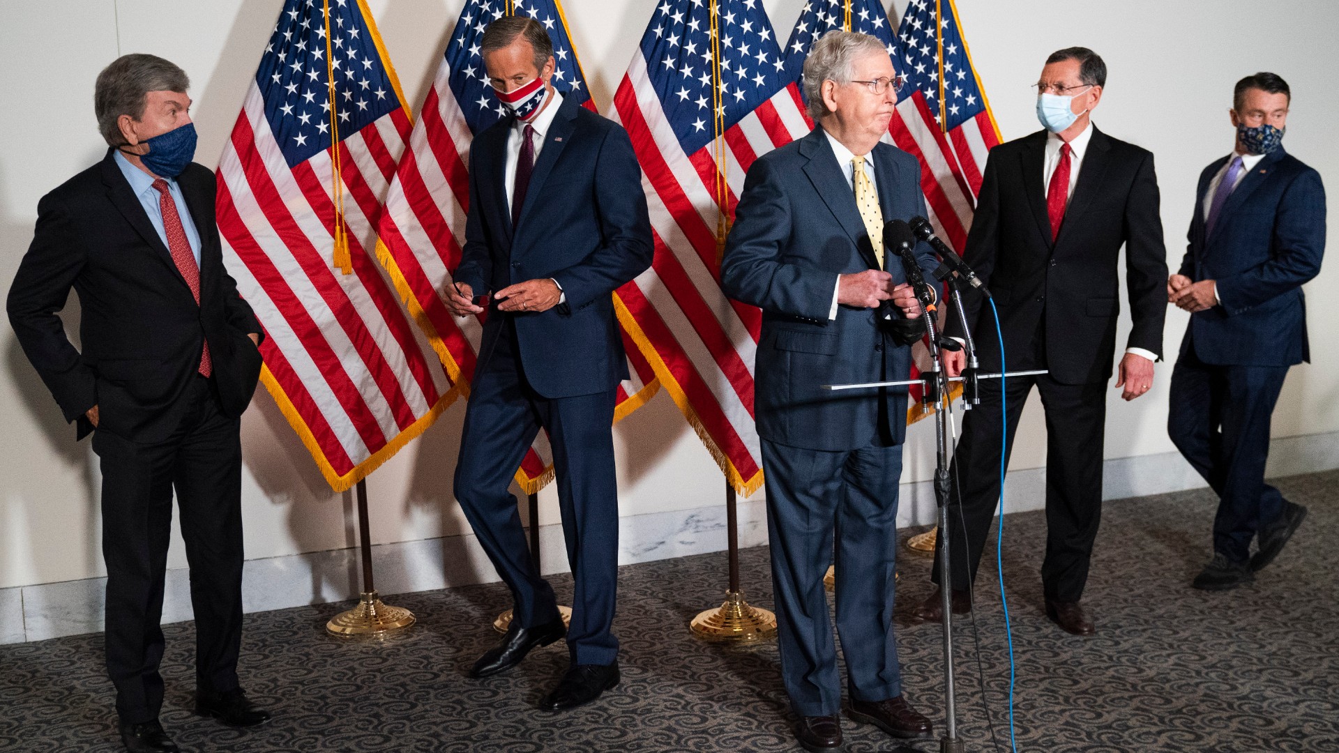 Senate Majority Leader Mitch McConnell of Ky., center, approaches the microphones accompanied by, from left, Sen. Roy Blunt, R-Mo., Sen. John Thune, R-S.D., Sen. John Barrasso, R-Wyo., and Sen. Todd Young, R-Ind., at the start of a news conference, Wednesday, Sept. 9, 2020, on Capitol Hill in Washington. (AP Photo/Jacquelyn Martin)