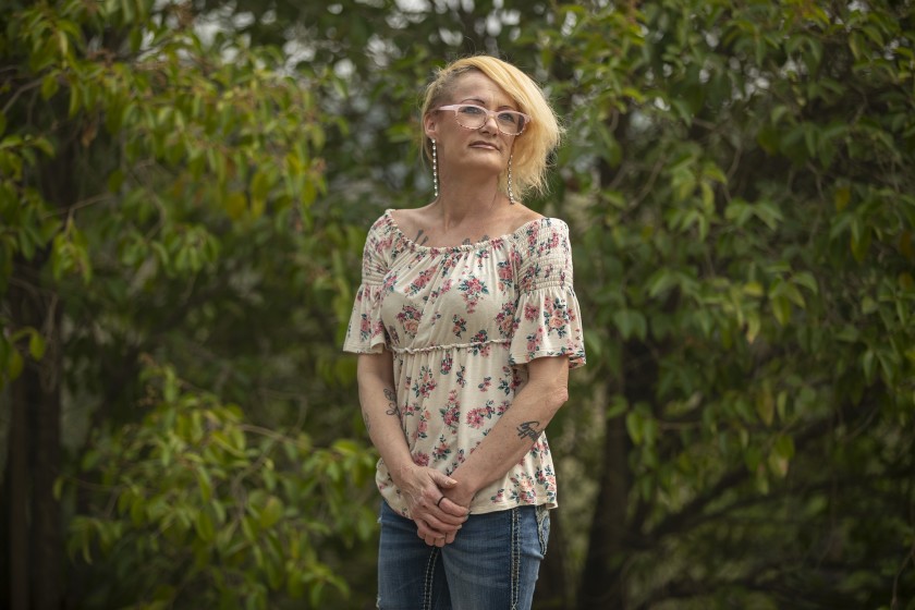 Tracey Aldrich stands before a relative’s home in Oroville, Calif. on Sept. 10, 2020. (Brian van der Brug / Los Angeles Times)