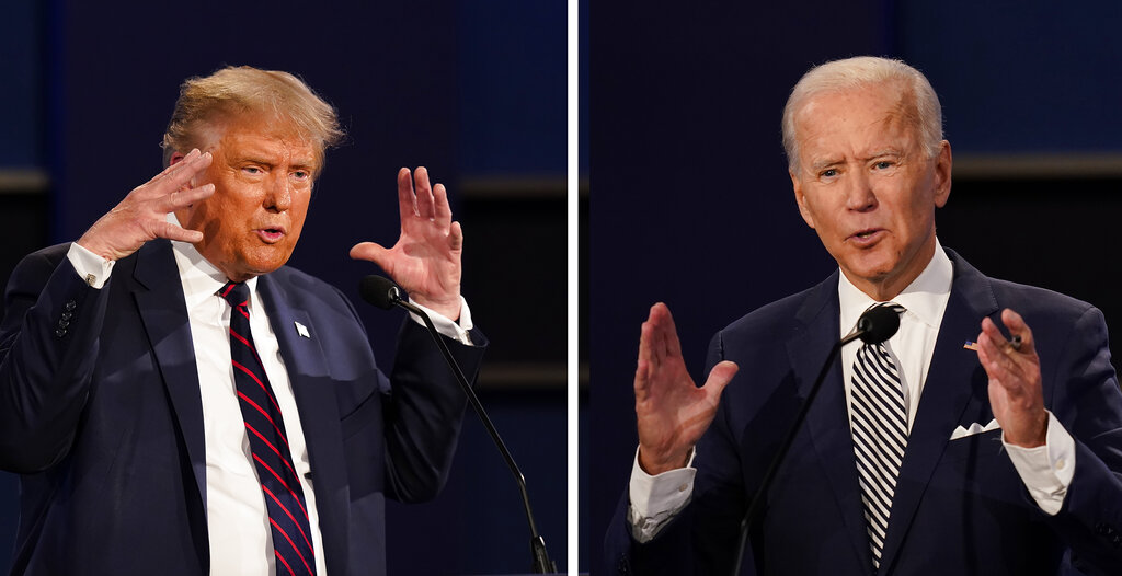 President Donald Trump and former Vice President Joe Biden during the first presidential debate at Case Western University and Cleveland Clinic, in Cleveland, Ohio. (AP Photo/Patrick Semansky)