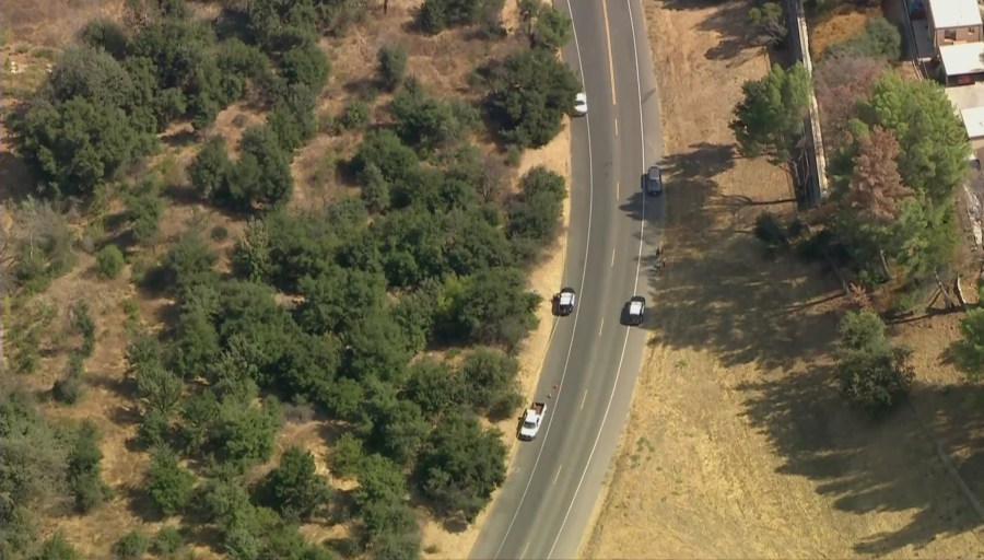 Los Angeles County Sheriff's Department patrol vehicles are seen near where a body was found in Agoura Hills on Sept. 24, 2020. (KTLA)