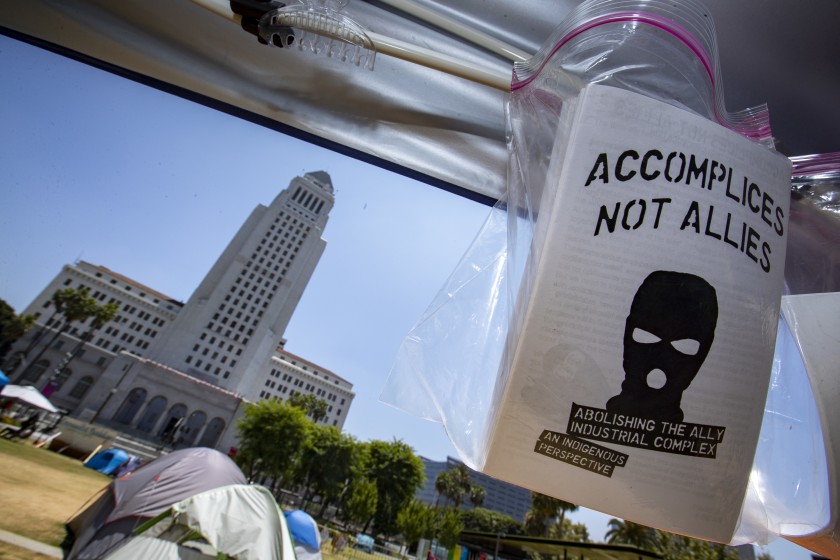 Sheriff’s deputies cleared out a protest encampment in downtown L.A.'s Grand Park, across from City Hall, early Sunday.(Brian van der Brug / Los Angeles Times)