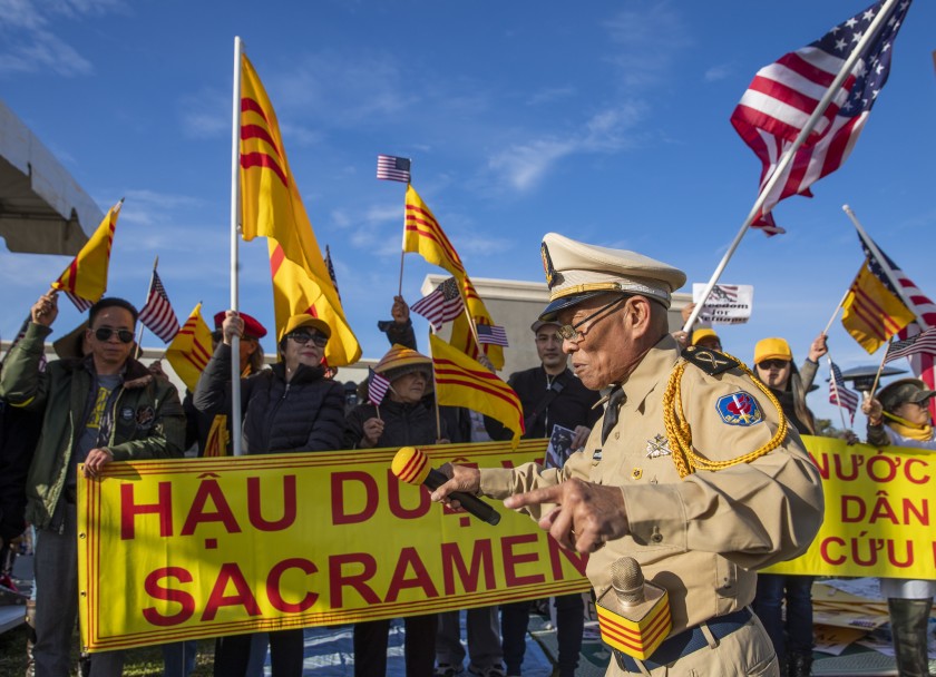 Vuong “Tom” Nguyen, a former South Vietnamese soldier, leads a group of protesters in Orange County’s Little Saigon. (Allen J. Schaben / Los Angeles Times)