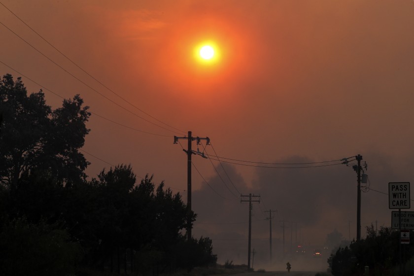 Heavy smoke from the Bobcat fire, seen from Cima Mesa Road in Juniper Hills blocks the sun on Sept. 18, 2020. (Irfan Khan / Los Angeles Times)