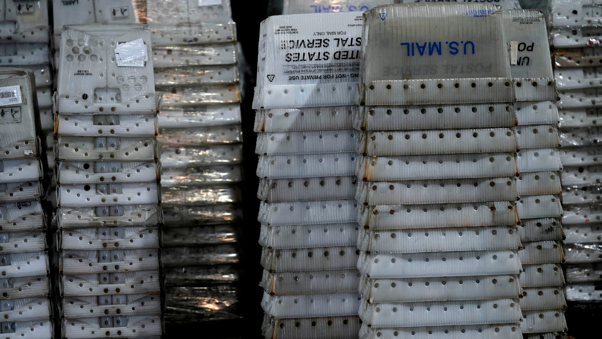 In this Thursday, Sept. 3, 2020 file photo, empty boxes await packages at the Wake County Board of Elections as workers prepare absentee ballots for mailing in preparation for the upcoming election in Raleigh, N.C. (AP Photo/Gerry Broome, File)