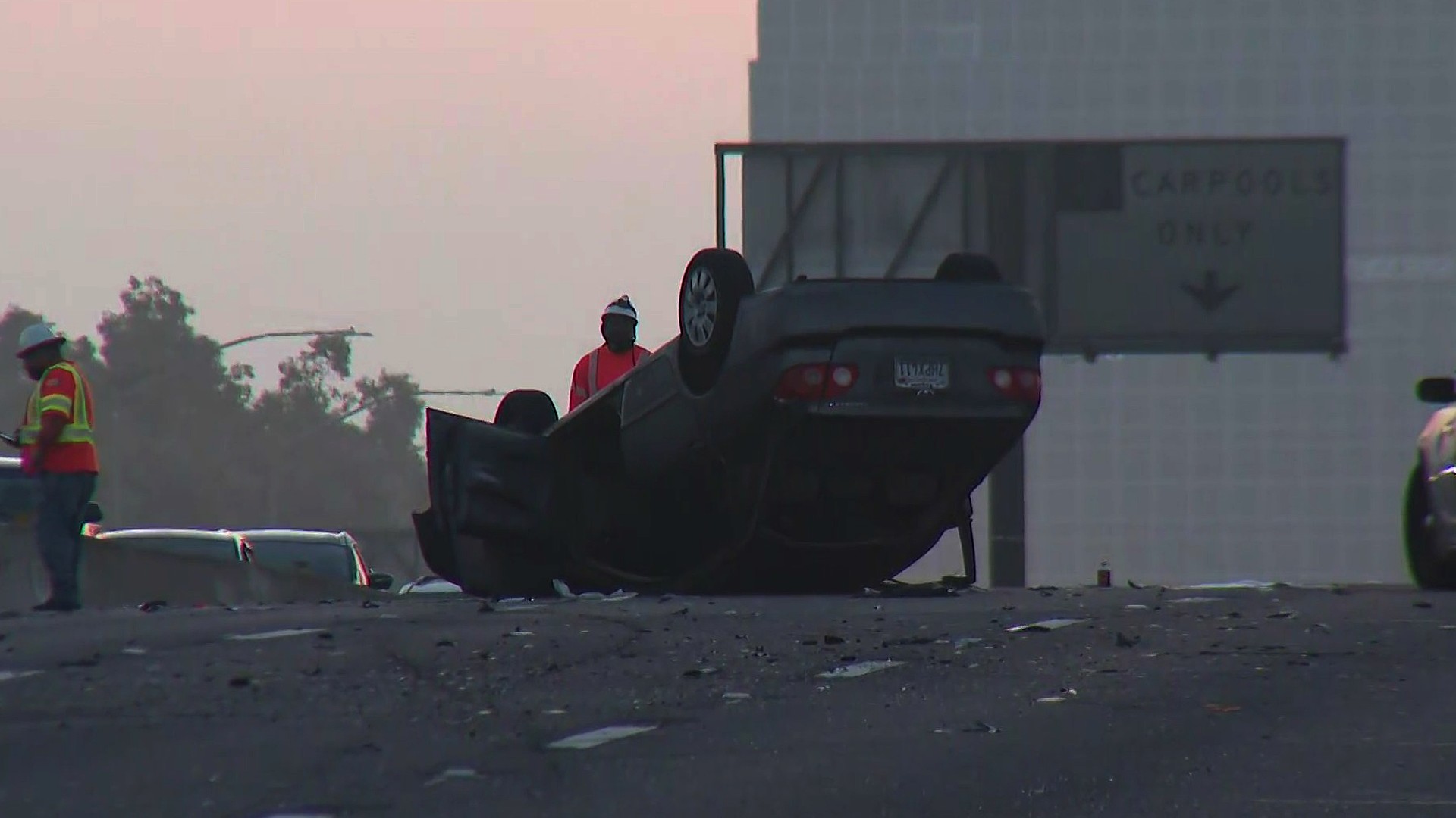 Crews respond to a fatal crash on the 405 Freeway in the Harbor Gateway area on Sept. 24, 2020. (KTLA)