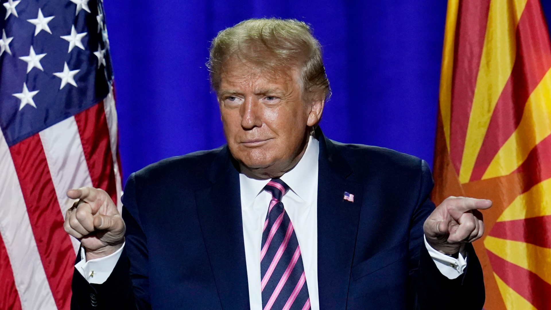 President Donald Trump acknowledges the crowd after participating in a Latinos for Trump Coalition roundtable Monday, Sept. 14, 2020, in Phoenix. (AP Photo/Ross D. Franklin)