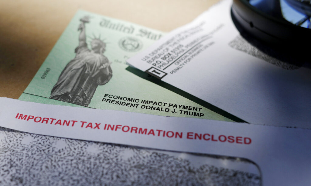 A stimulus check issued by the IRS to help combat the adverse economic effects of the COVID-19 outbreak is shown in this file photo from April 23, 2020. (Eric Gay/Associated Press)