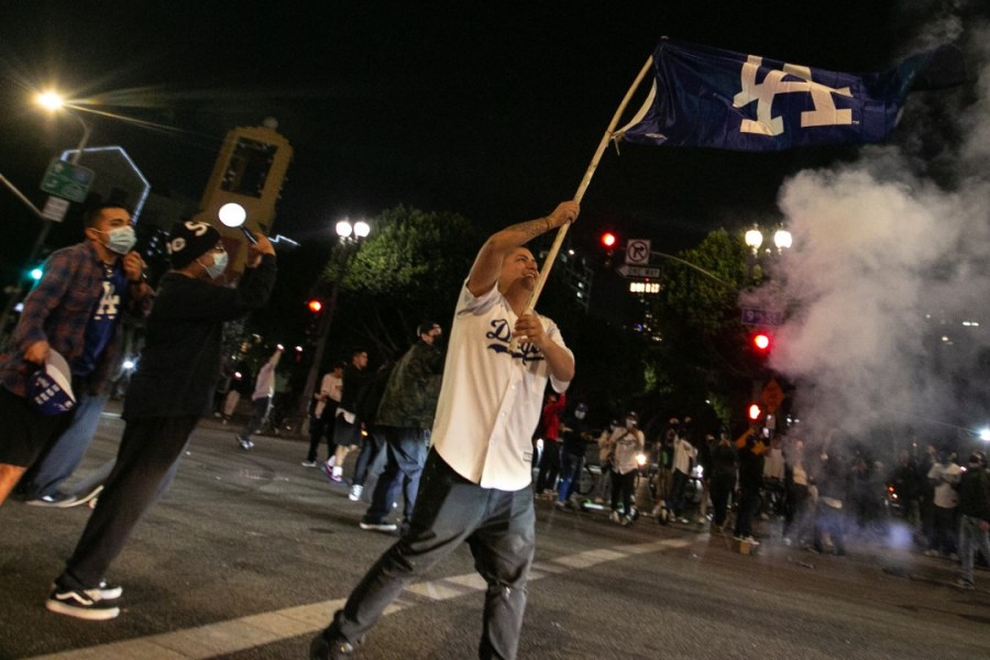 Fans celebrate in downtown Los Angeles after the Los Angeles Dodgers’ victory in the World Series on Oct. 27, 2020. (Jason Armond / Los Angeles Times)