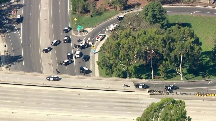 Police vehicles block an on ramp of the 605 Freeway during a shooting investigation on Oct. 15, 2020. (KTLA)