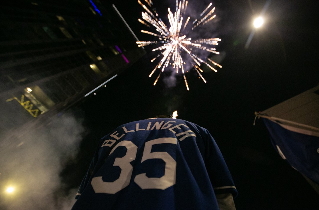 Fireworks light up the sky in downtown Los Angeles as fans celebrate after the Los Angeles Dodgers defeated the Tampa Bay Rays in Game 6 to win the World Series on Oct. 27, 2020. (Jason Armond / Los Angeles Times)