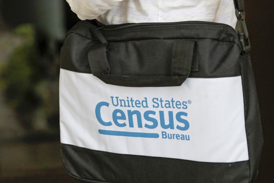 A briefcase of a census taker is seen as she knocks on the door of a residence on Aug. 11, 2020, in Winter Park, Fla. (John Raoux/Associated Press)