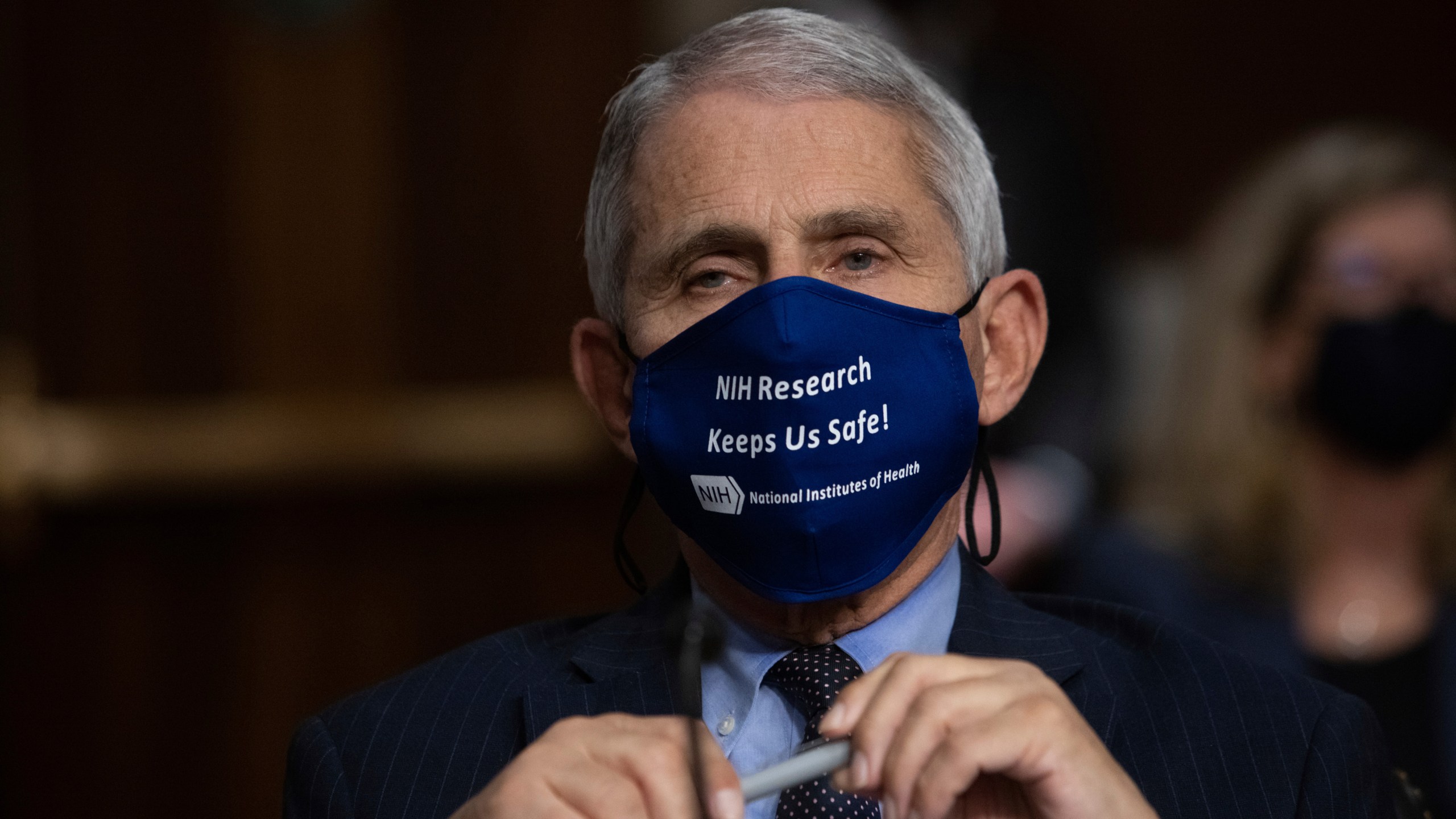 Dr. Anthony Fauci, Director of the National Institute of Allergy and Infectious Diseases at the National Institutes of Health, listens during a Senate Senate Health, Education, Labor, and Pensions Committee Hearing on the federal government response to COVID-19 Capitol Hill on Wednesday, Sept. 23, 2020, in Washington. (Graeme Jennings/Pool via AP)