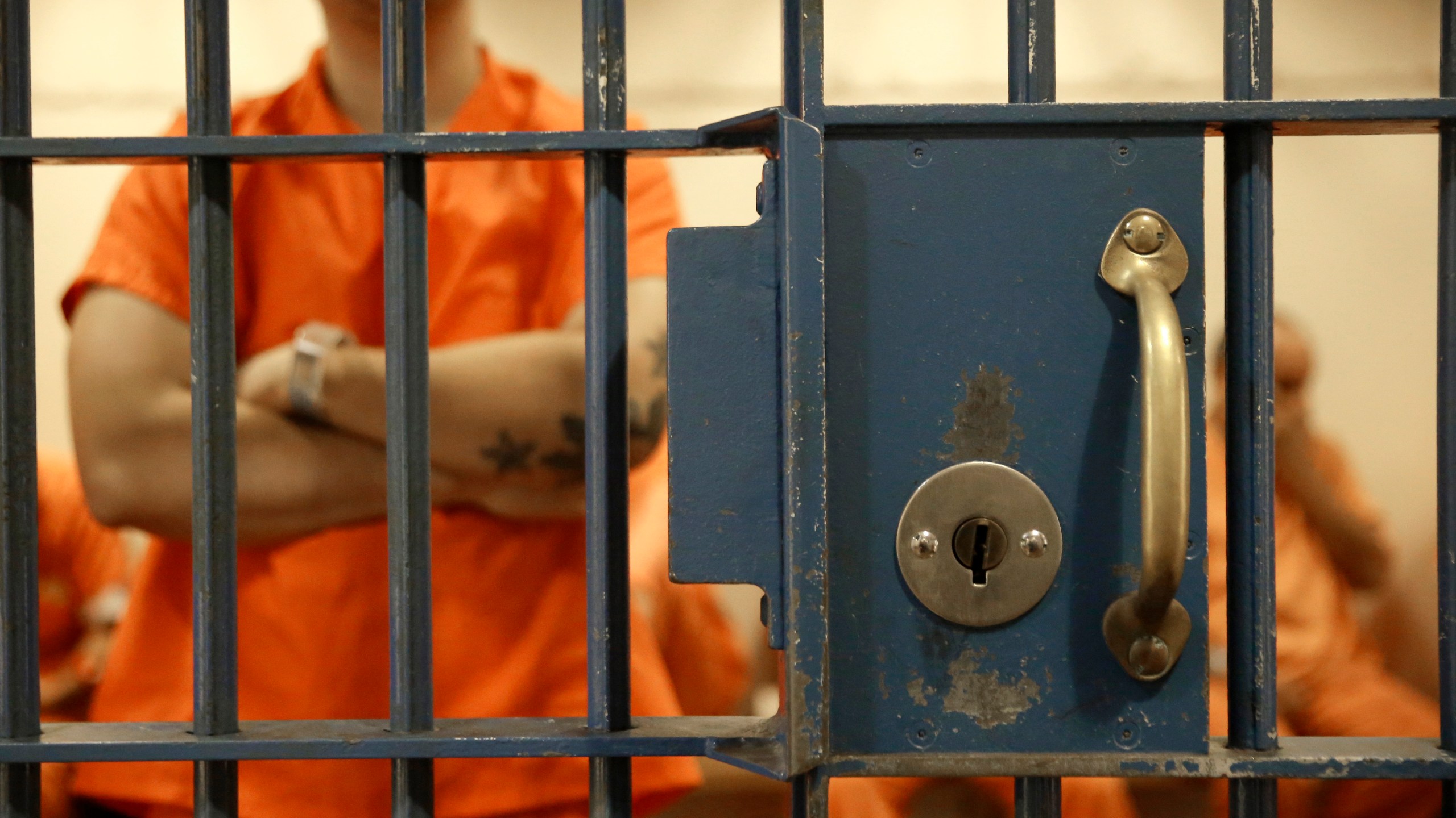 In this Nov. 1, 2016, file photo, detainees wait in a cell for an appearance in Sacramento County Superior Court in Sacramento, Calif. In November 2020, California voters will consider rolling back a host of criminal justice changes in what amounts to a referendum on whether the famously progressive state has become too lenient. Proposition 20 would amend criminal sentencing and supervision laws enacted during the administration of Gov. Jerry Brown that critics say are too favorable to criminals, while Proposition 25 could overturn a 2018 law that eliminates cash bail. (AP Photo/Rich Pedroncelli, File)