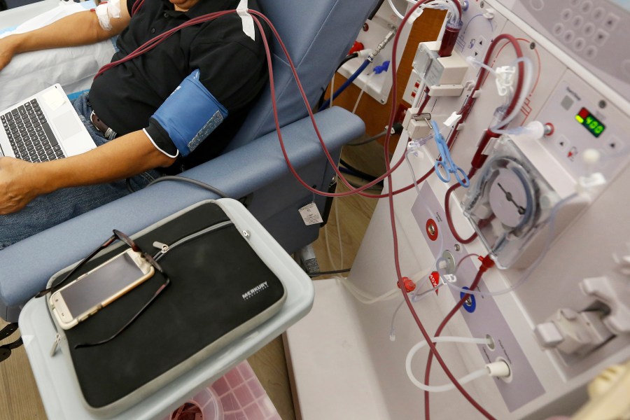 A patient undergoes dialysis at a clinic in Sacramento on Sept. 24, 2018. In November 2020, California voters will again weigh the quality of care dialysis clinics provide to about 80,000 people in the state with kidney failure. Proposition 23 would require a doctor or highly trained nurse at each of the state's 600 dialysis clinics whenever patients are being treated to improve patient care. It was placed on the ballot by unions that represent health care workers. (AP Photo/Rich Pedroncelli, File)