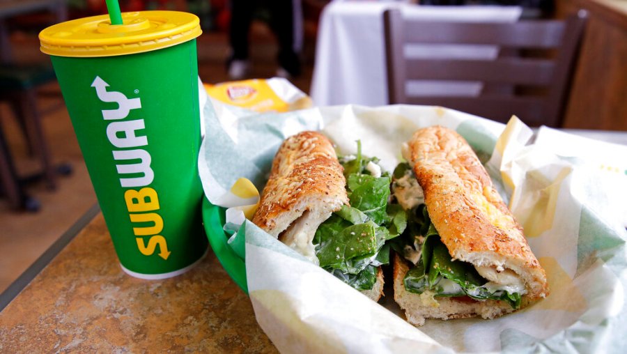 In this Feb. 23, 2018 file photo, a sandwich and a Subway soft drink cup are seen at a restaurant in Londonderry. (AP Photo/Charles Krupa, File)