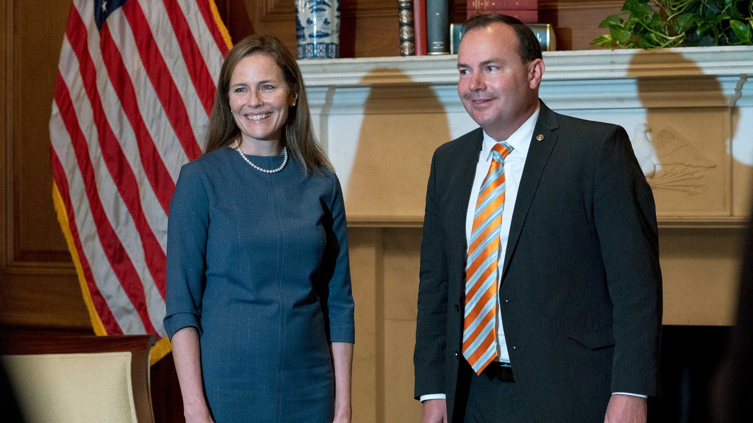 In this Sept. 29, 2020, photo, Judge Amy Coney Barrett, President Donald Trump's nominee to the Supreme Court, poses with Sen. Mike Lee, R-Utah, both without masks, at the Capitol in Washington. (Stefani Reynolds/Pool via AP, File)