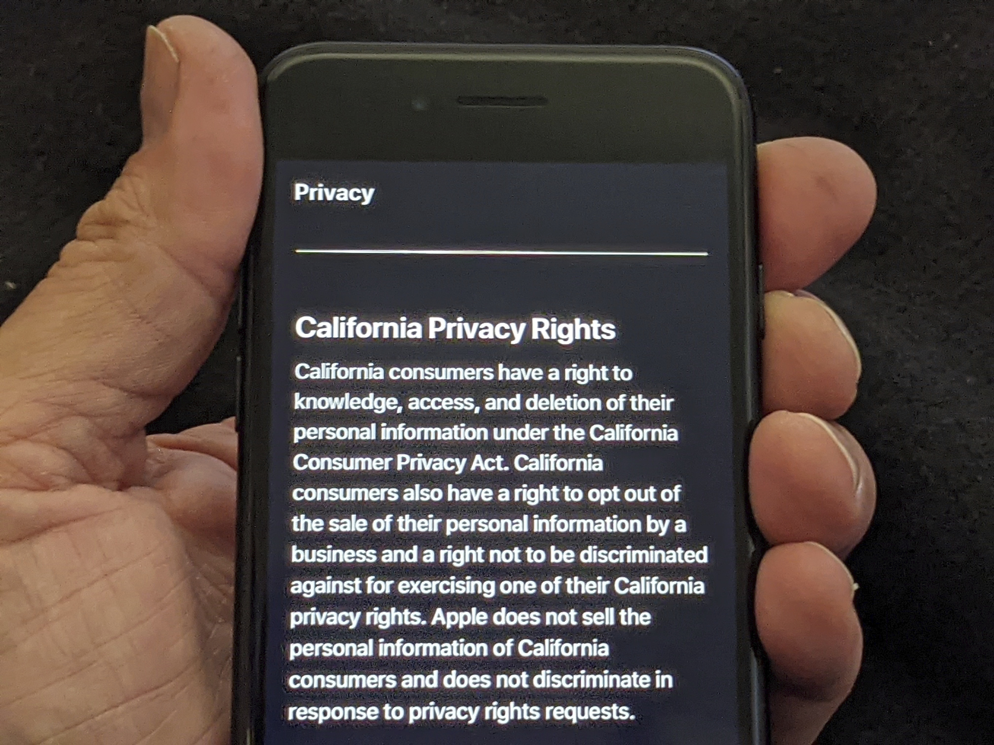 This photo illustration shows Apple's privacy policy on an iPhone in Los Angeles Friday, Oct. 2, 2020. (AP Photo/Damian Dovarganes)