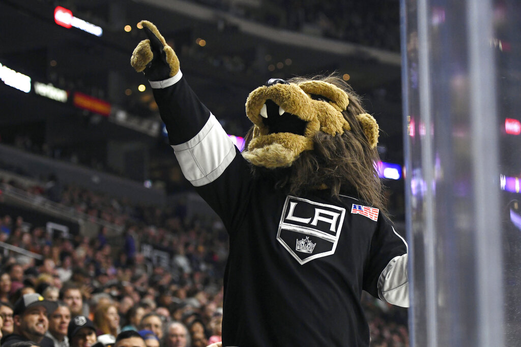 In this Sept. 30, 2017, file photo, Los Angeles Kings mascot Bailey entertains the crowd during a preseason NHL hockey game against the Anaheim Ducks in Los Angeles. (AP Photo/Michael Owen Baker, File)